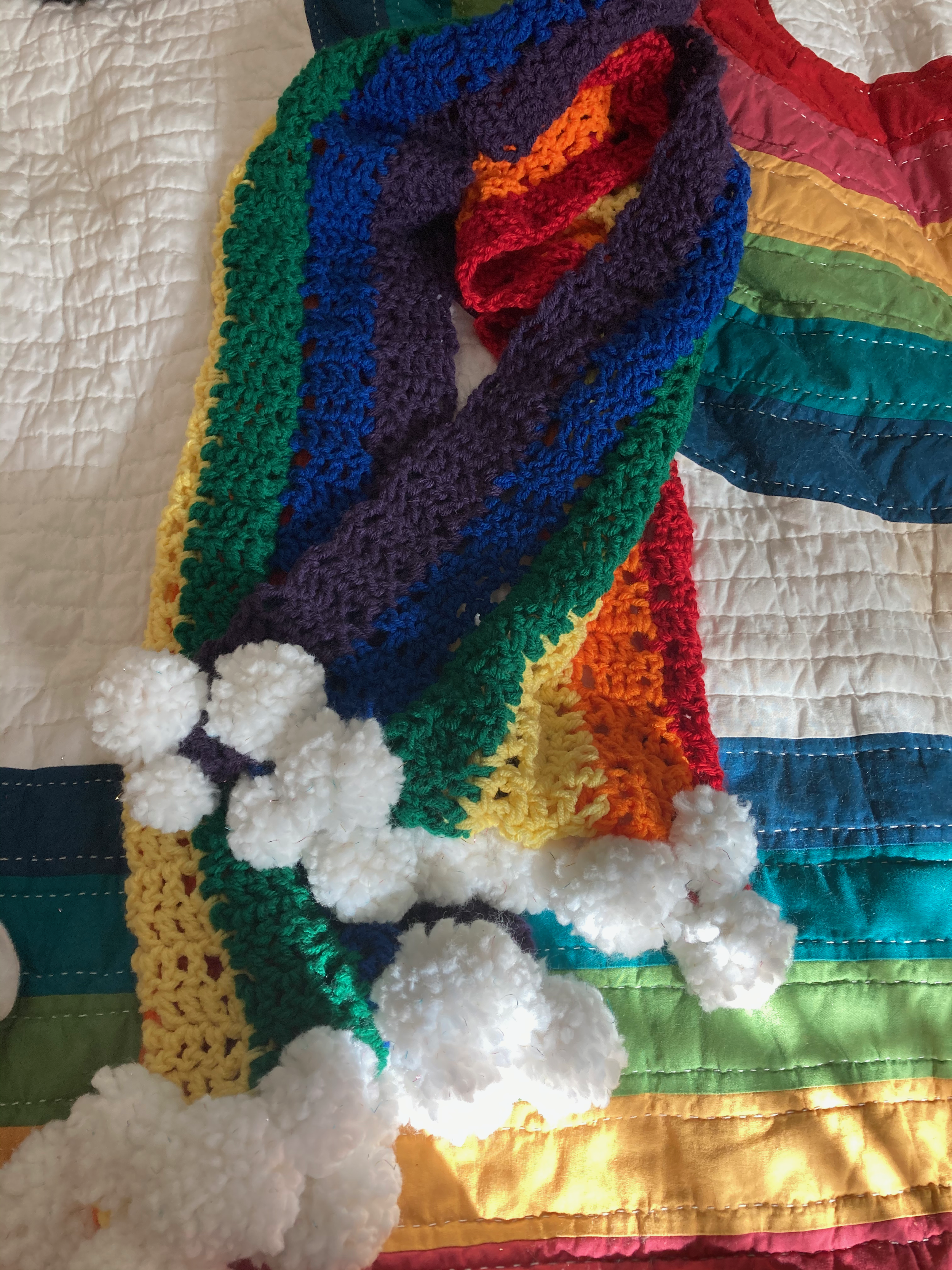 rainbow fingerknit scarf -- begun in 2013 and finished (s/o to pom pom makers) in july 2021 | 

tutorial by marlena (she.makes.rainbows on ig) for rookie mag