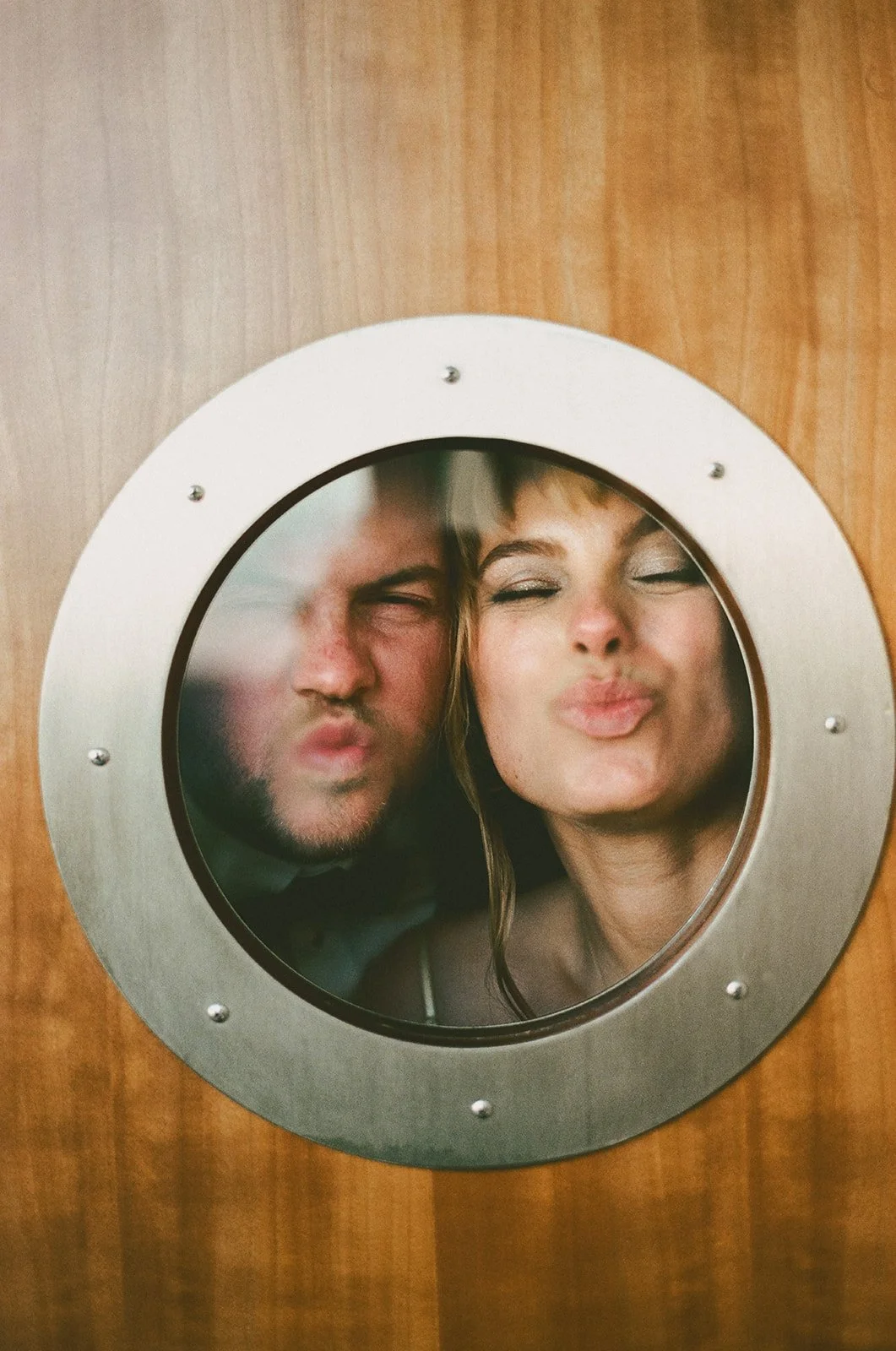 newly married couple taking funny photo