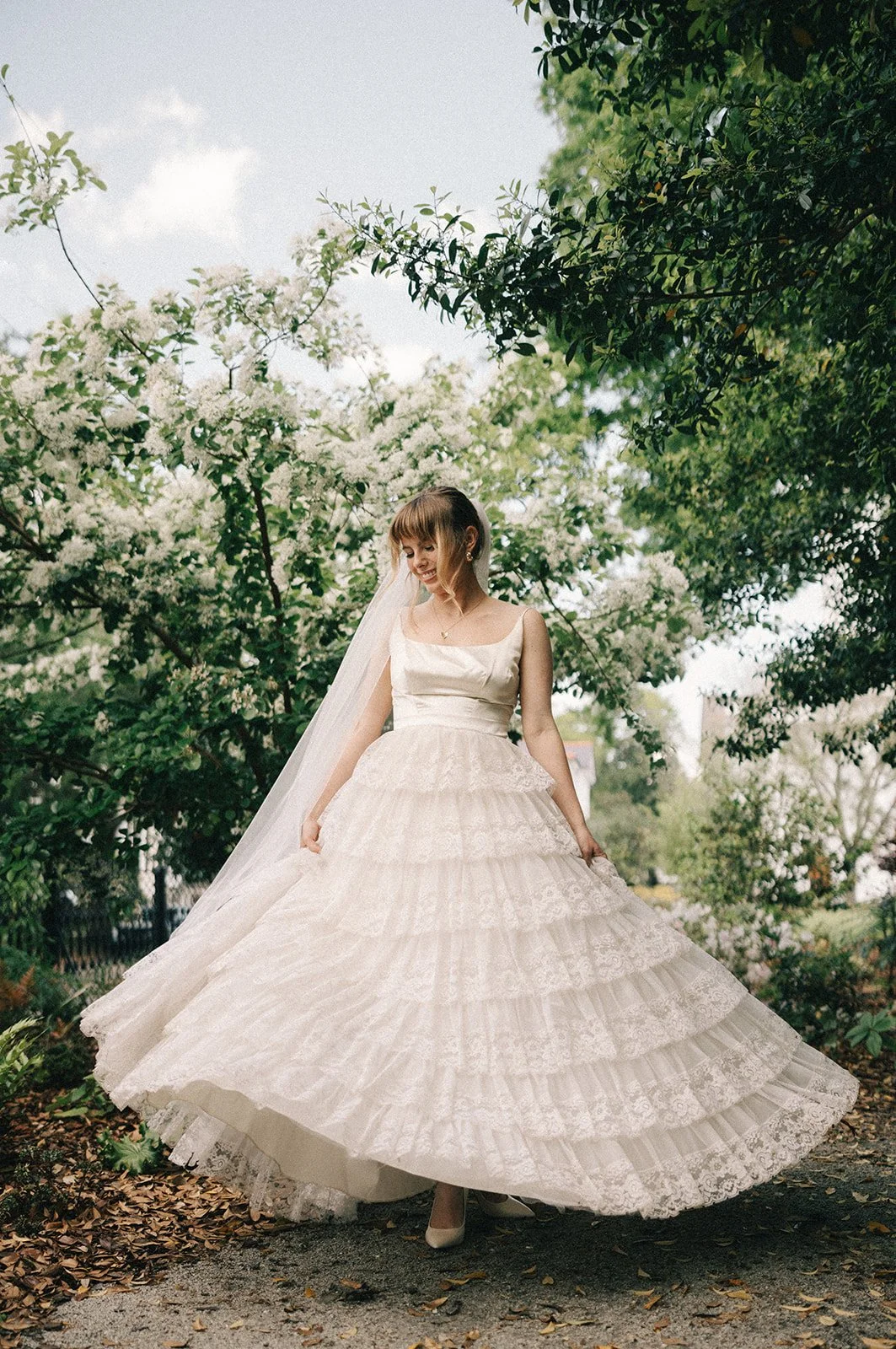 bride dancing in a garden
