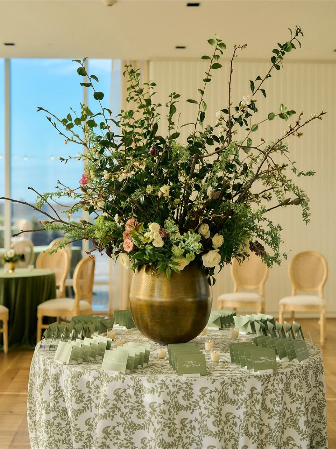 The details from this day still stand out in my mind &mdash; every single one intentional and beautiful. The matchboxes with their initials, the elegant name cards, and the floral palette of purples, greens, yellows, and whites that pulled the whole 