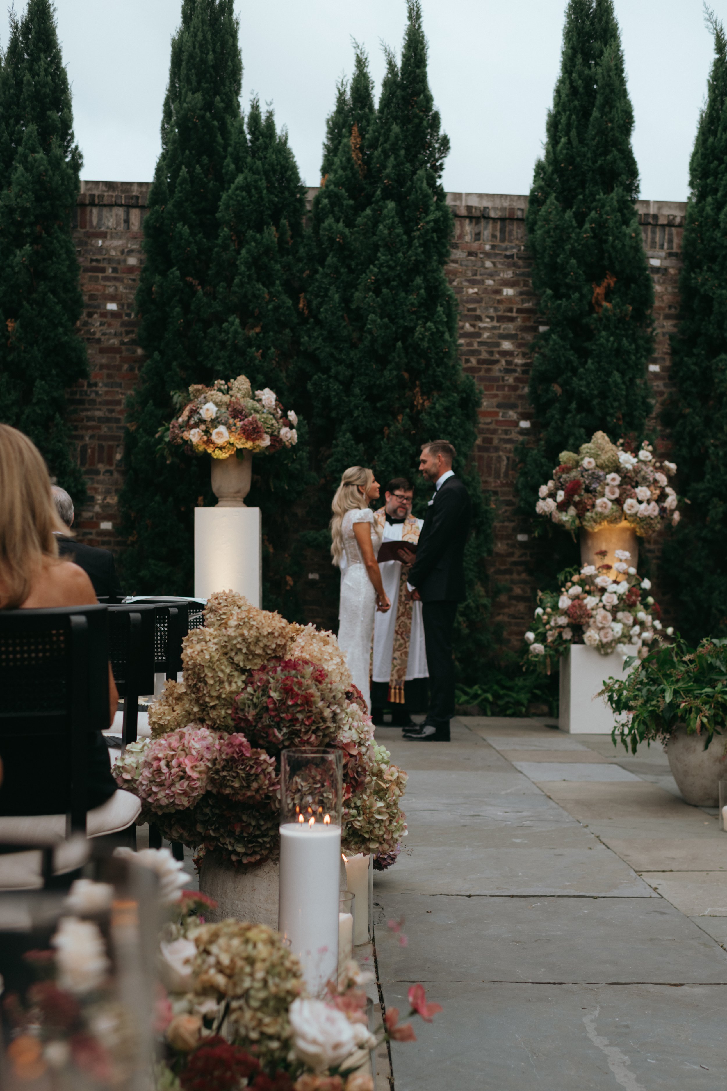 couple exchanging vows at sunset on their wedding day