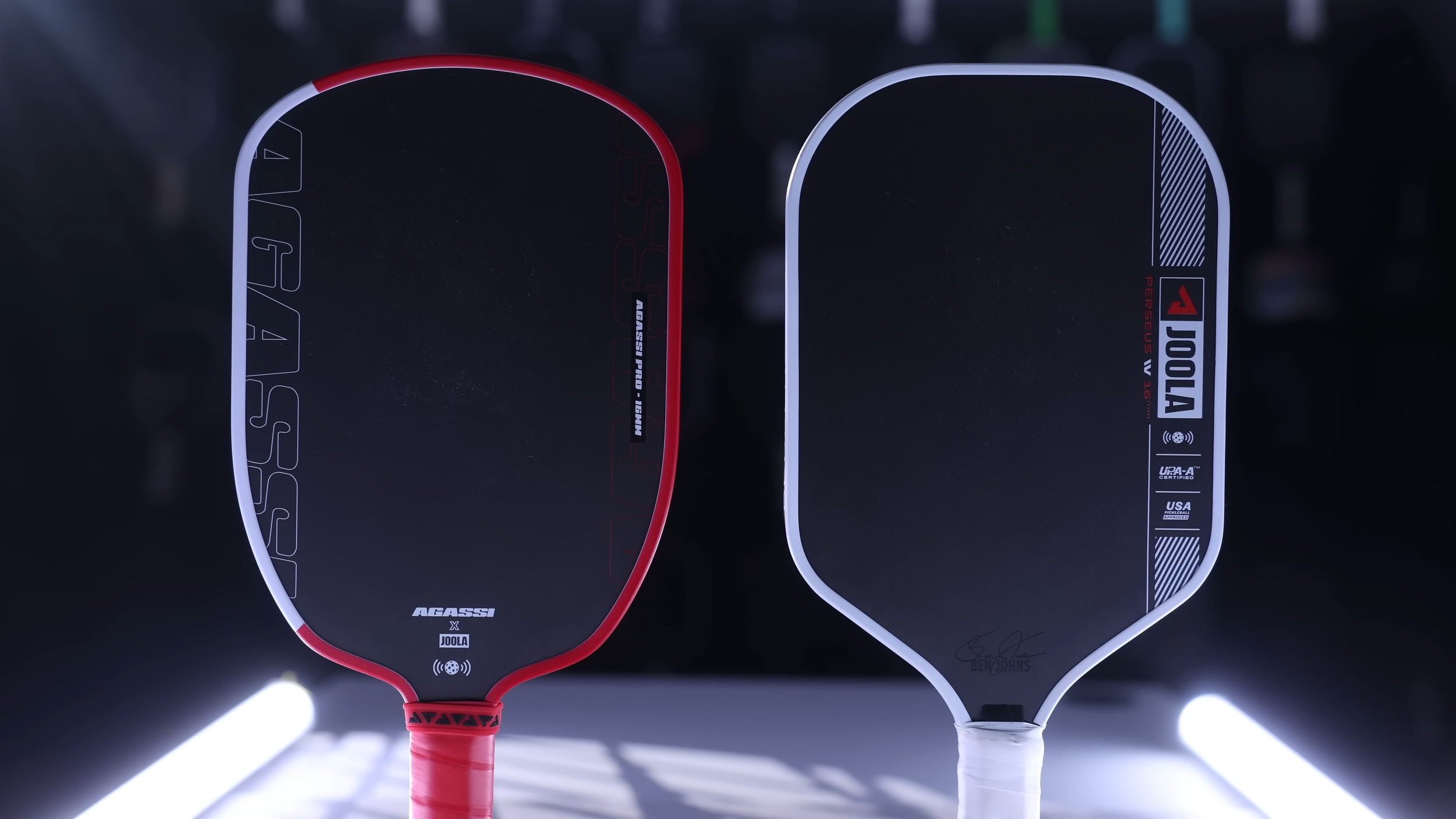 JOOLA Agassi Perseus and JOOLA Pro IV pickleball paddles side by side with red and white designs