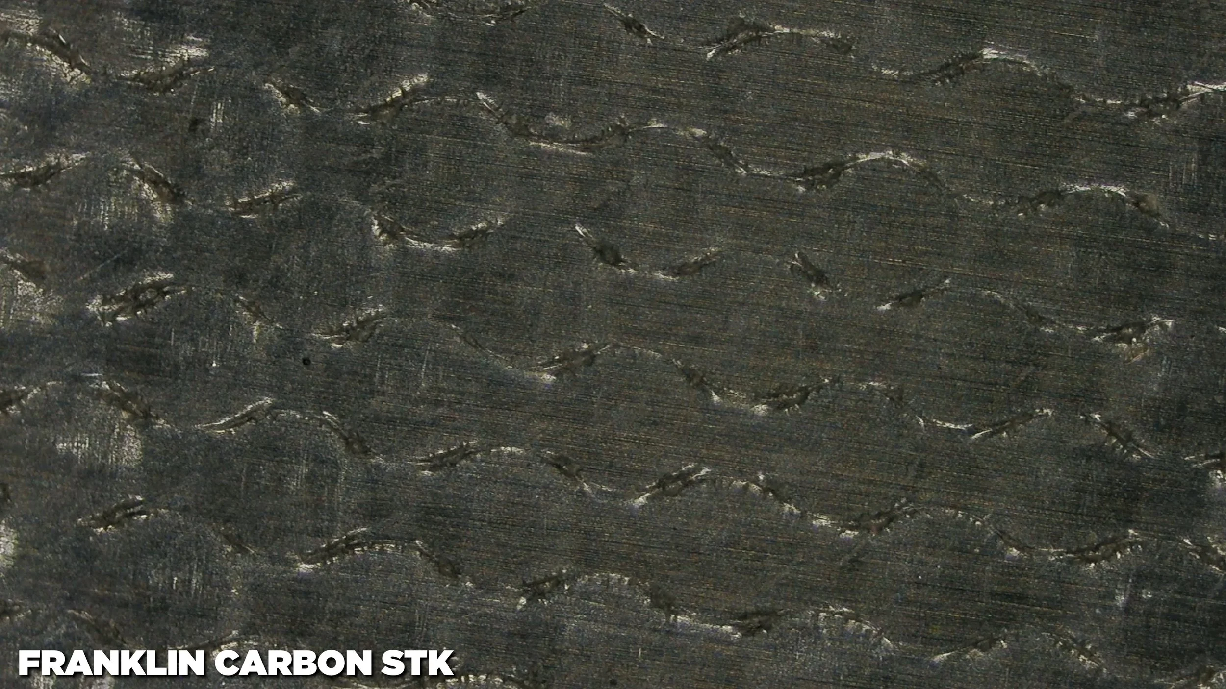 Franklin Carbon STK pickleball paddle center face texture showing wave-like grit pattern for spin