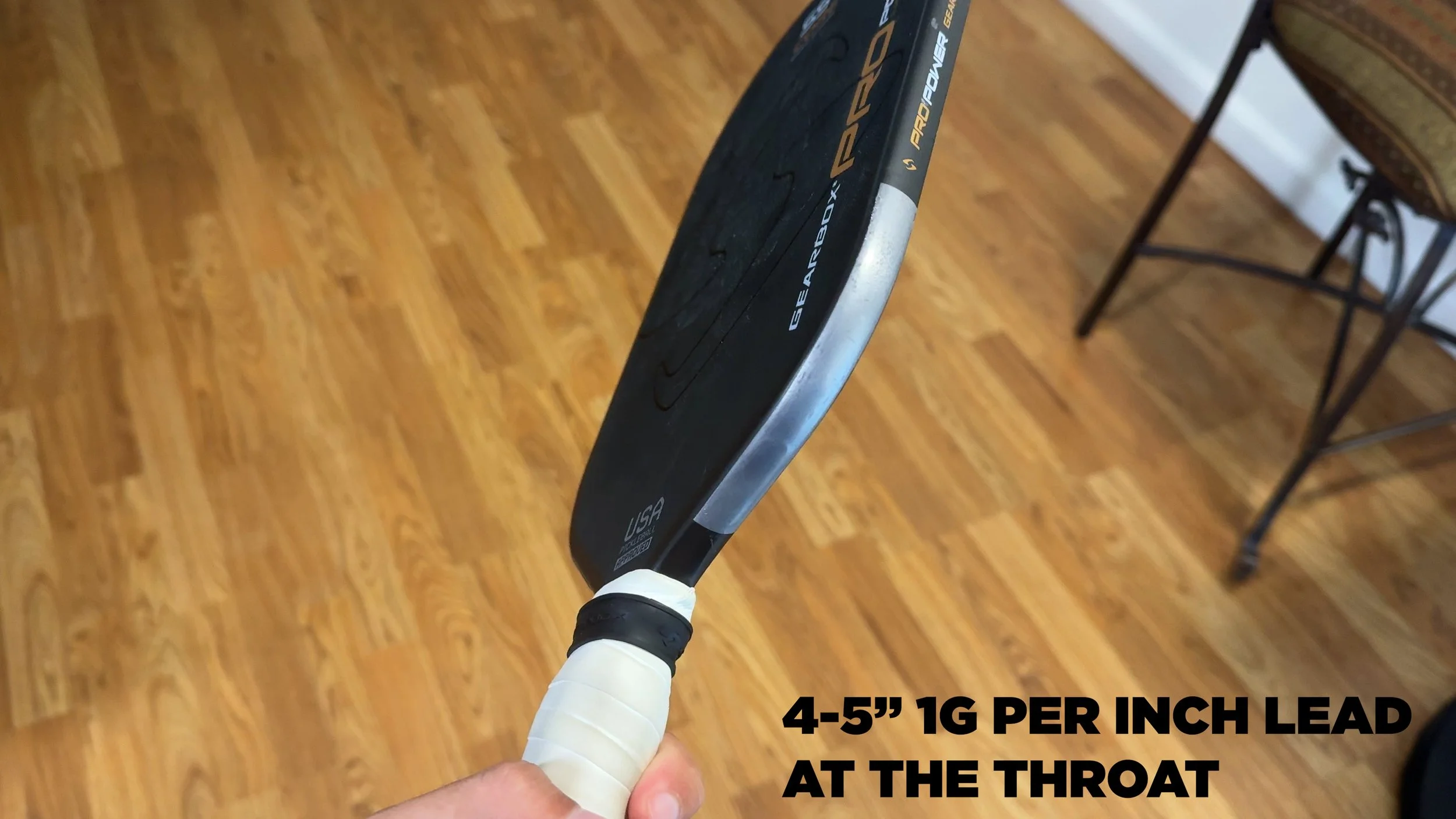 Gearbox Pro Power pickleball paddle with lead tape applied at the throat, showing 4-5 inches of 1g per inch placement