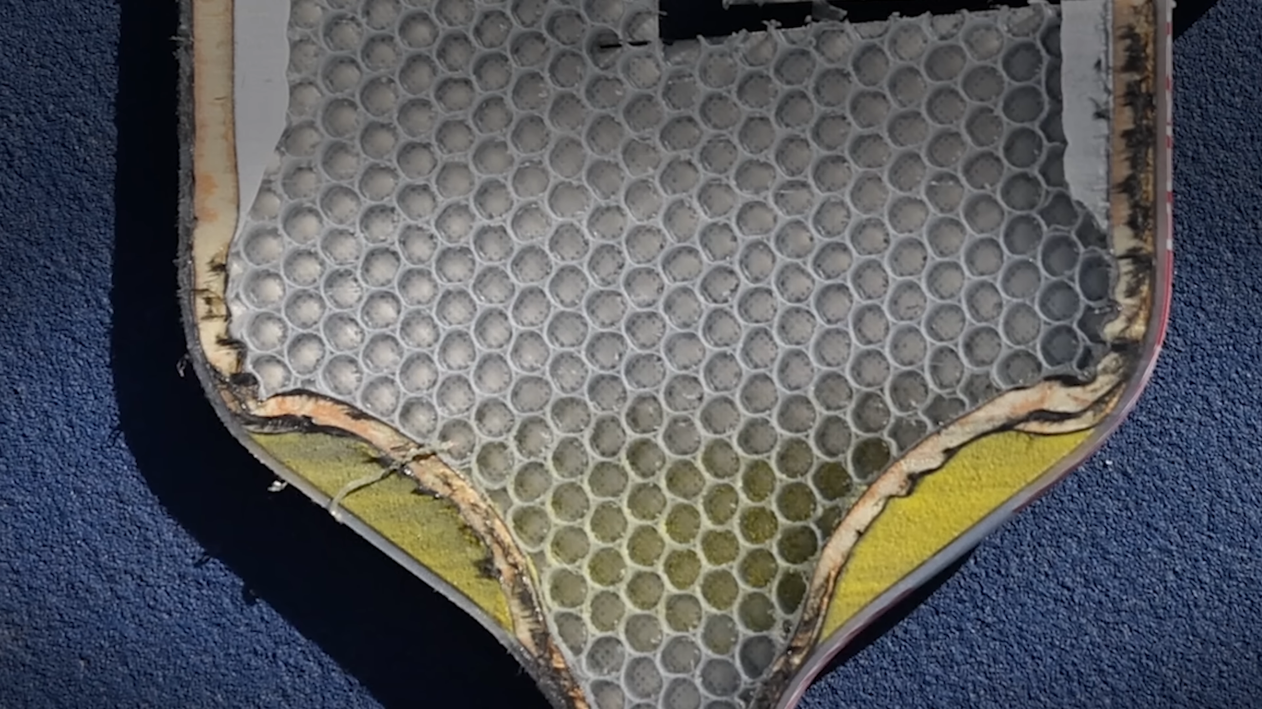 JOOLA pickleball paddle teardown showing honeycomb core construction and edge foam
