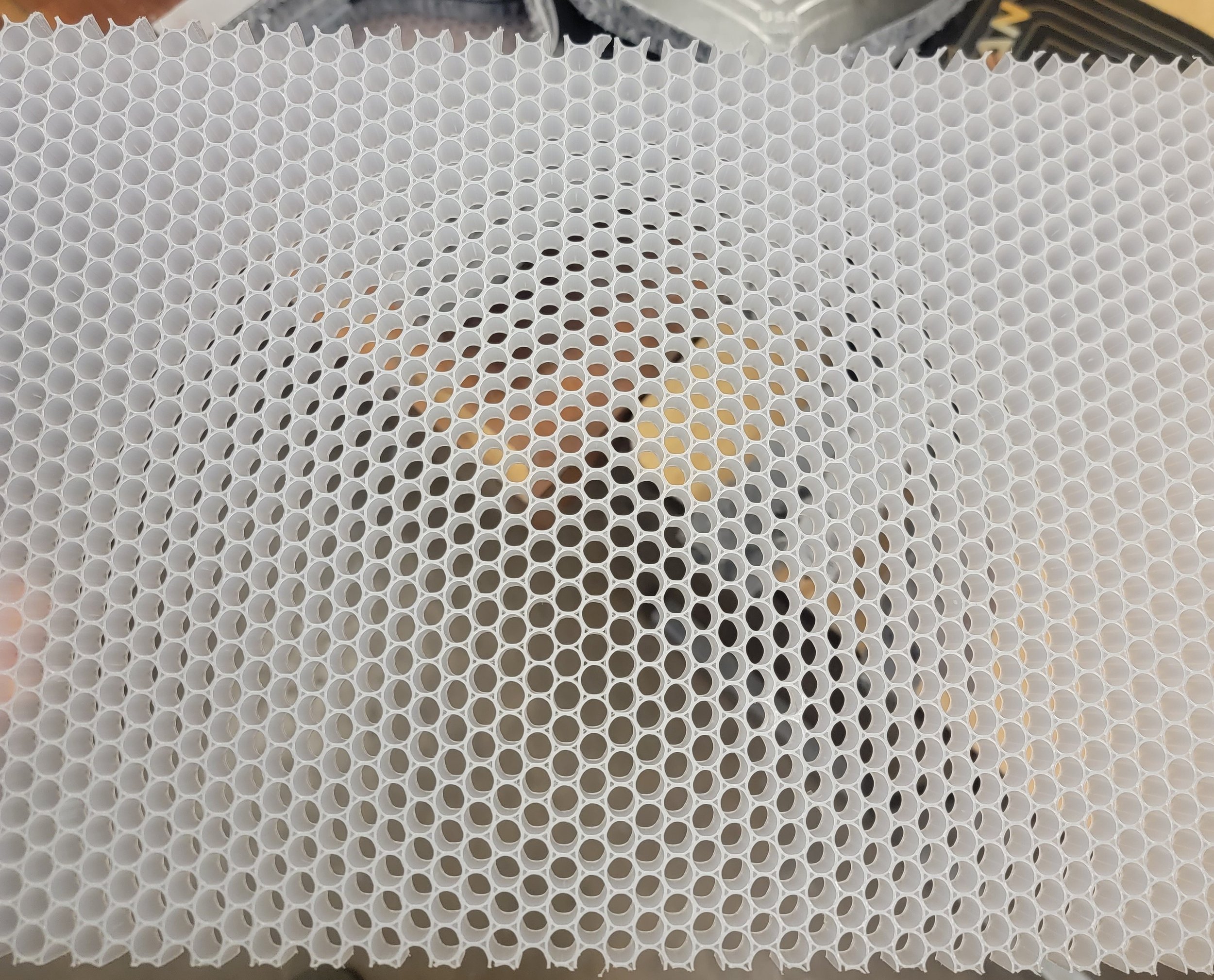 Close-up of polymer honeycomb core material used in pickleball paddles