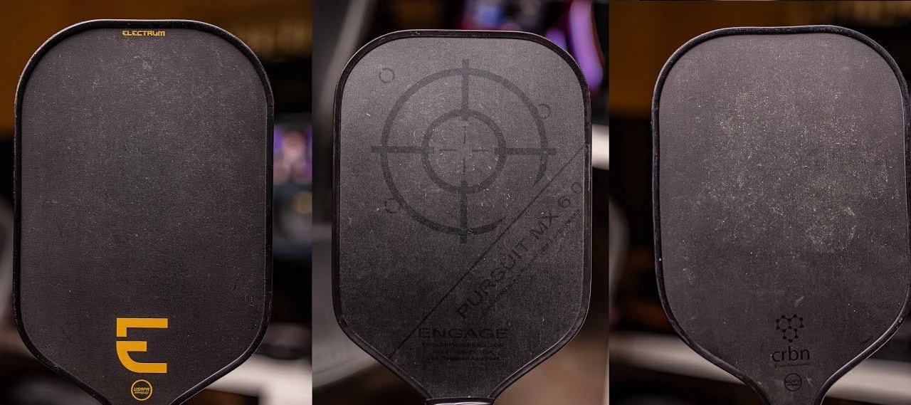 Three raw carbon fiber pickleball paddle faces showing textured gritty surface up close