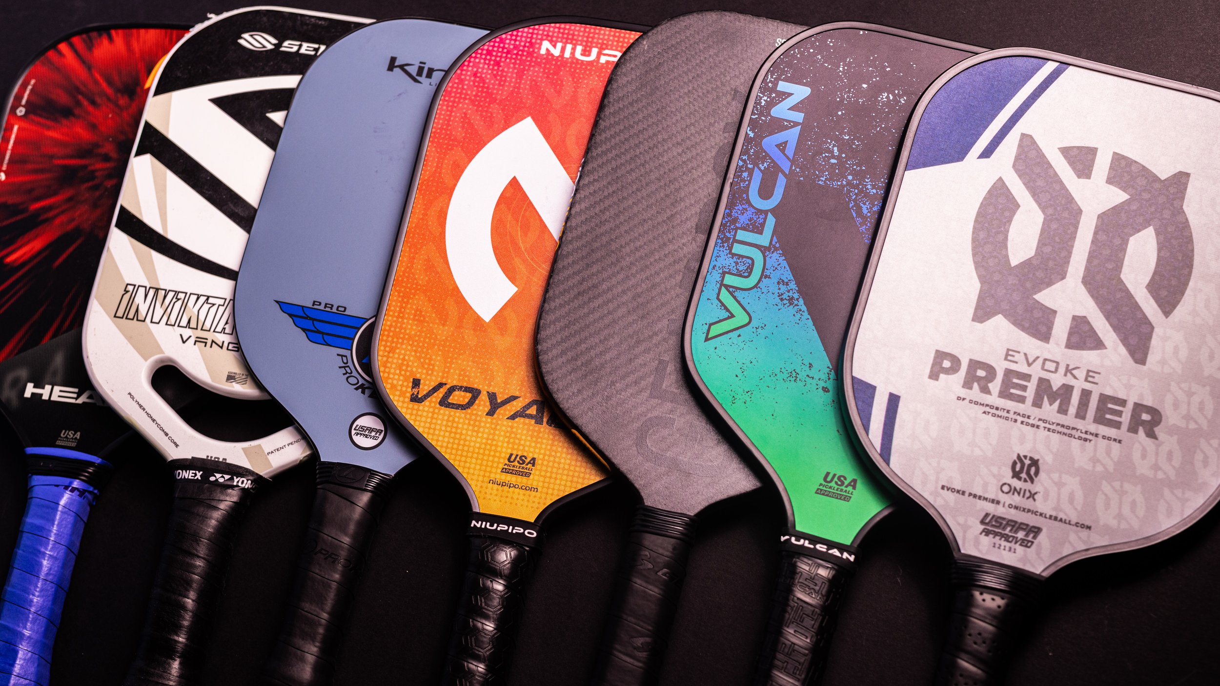 Collection of top control pickleball paddles including Selkirk, Niupipo, Vulcan, and Onix Evoke Premier