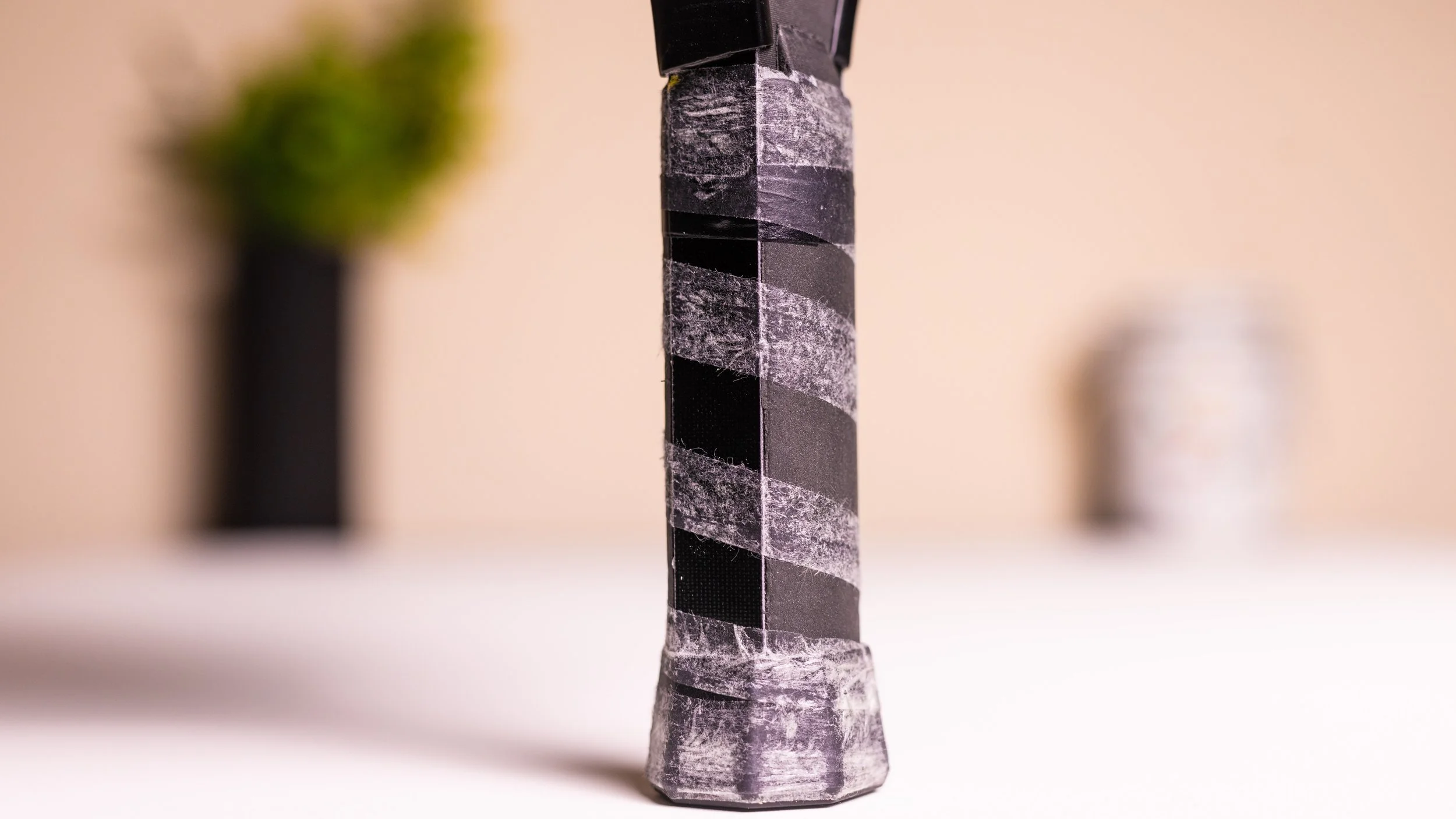 Electrum Model E 13mm pickleball paddle handle close-up showing carbon fiber construction