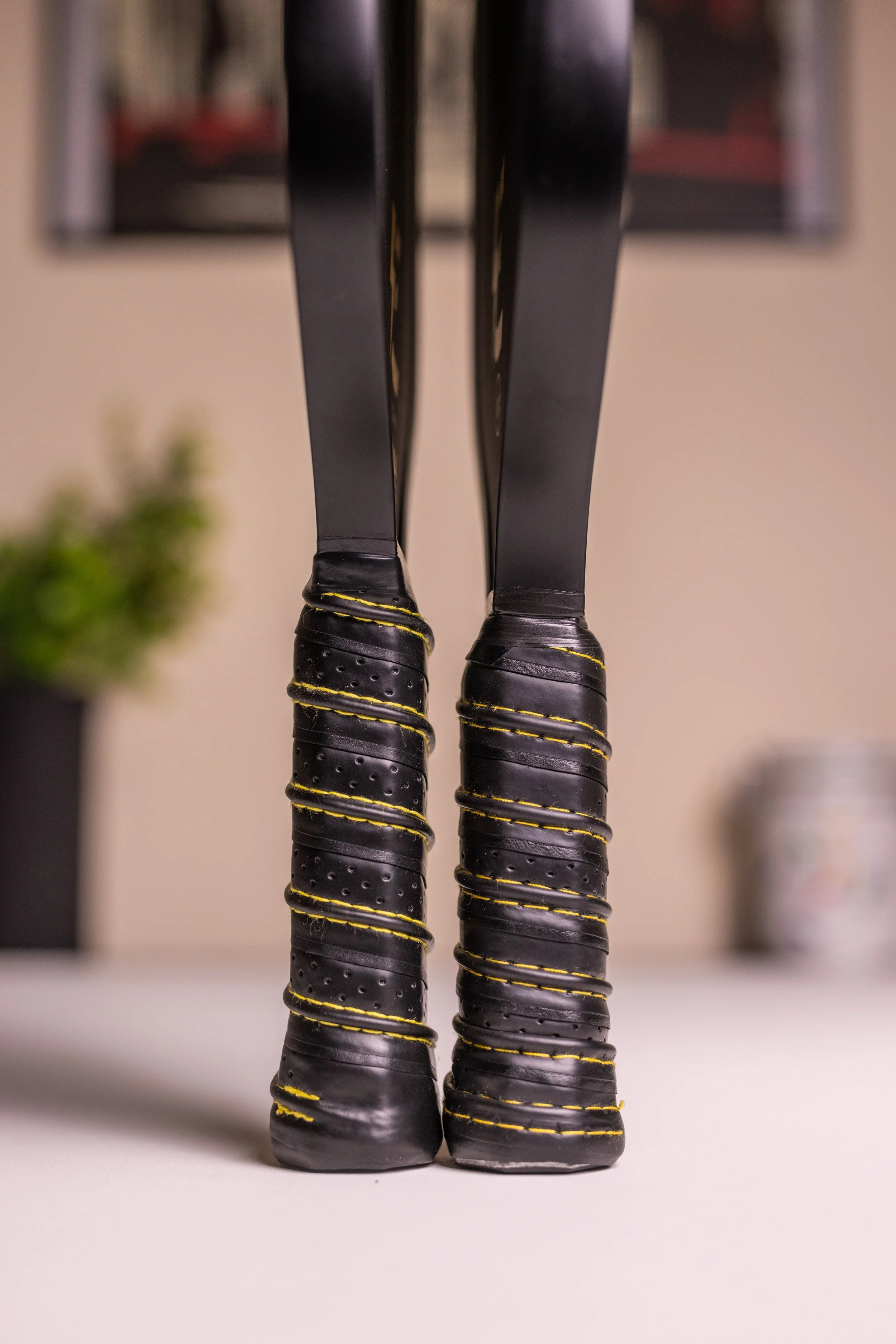 Two Electrum Model E 13mm pickleball paddle handles side by side showing butt cap design