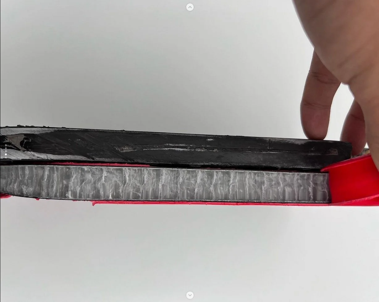 Legacy Pro pickleball paddle cross-section showing honeycomb core and carbon fiber face layers