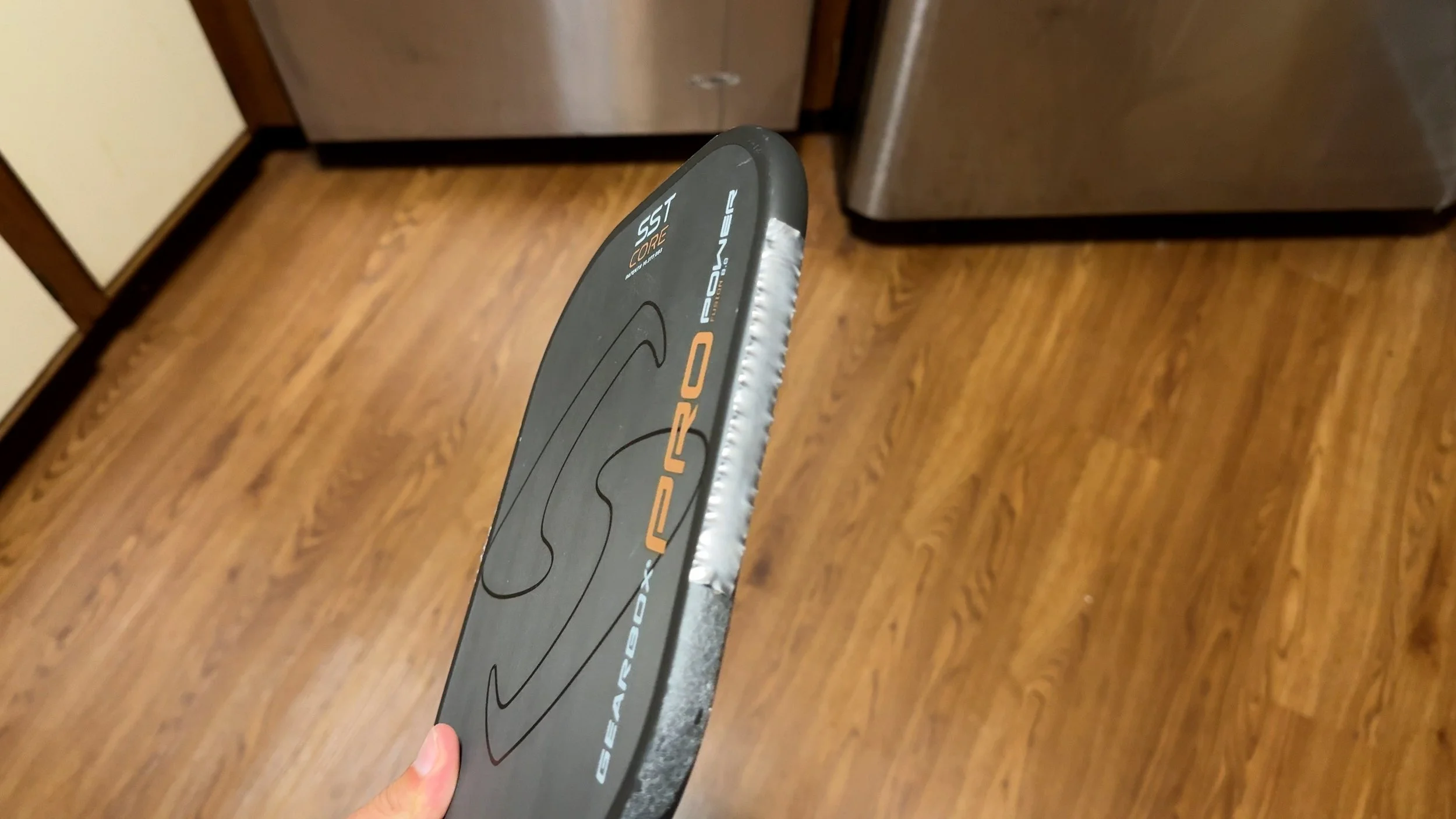 Side view of Gearbox Pro Power pickleball paddle showing lead tape along the edge guard