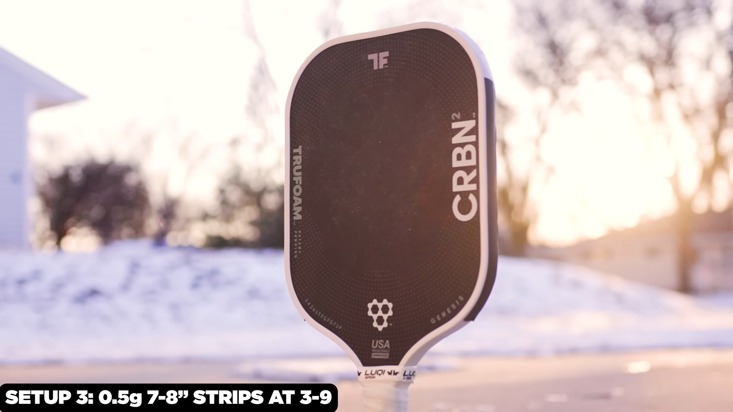 CRBN TruFoam Genesis 2 pickleball paddle outdoors in snow with weight setup of 0.5g strips at 3 and 9 o'clock