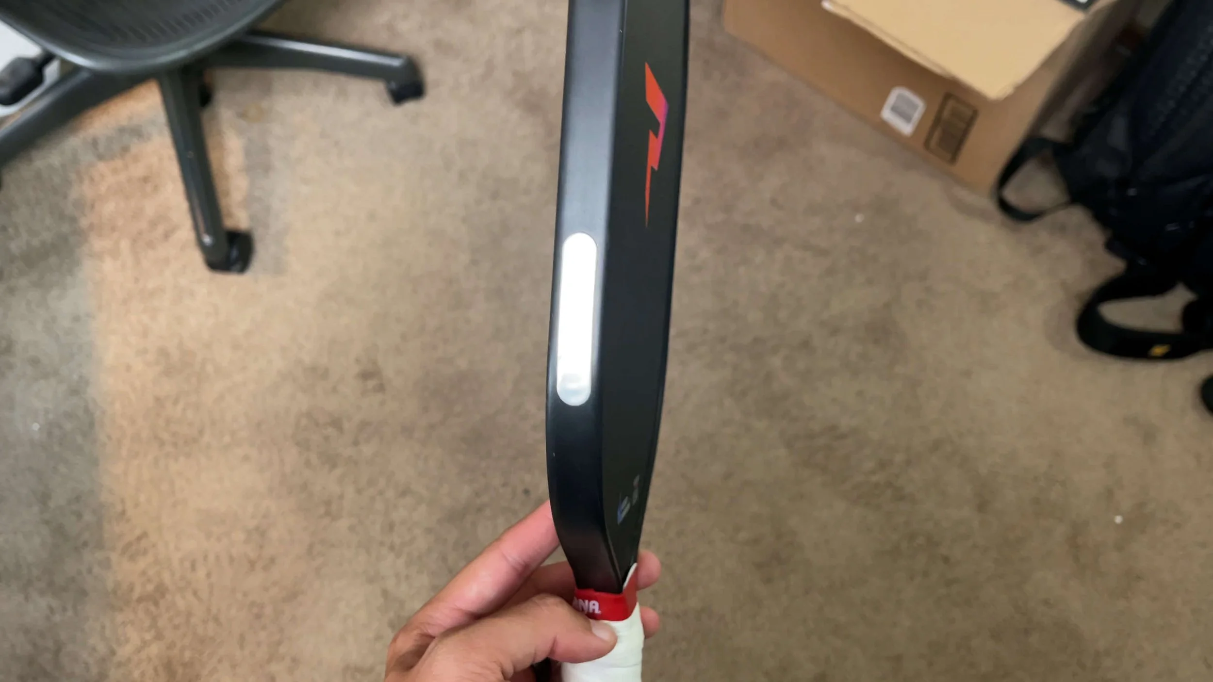 PaddleTek Tempest v3 pickleball paddle edge profile showing lead tape placement on edge guard