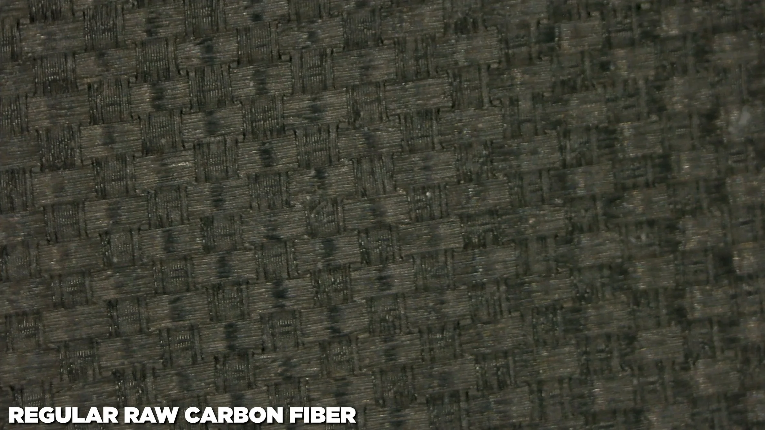 Regular raw carbon fiber surface texture macro close-up on a pickleball paddle face