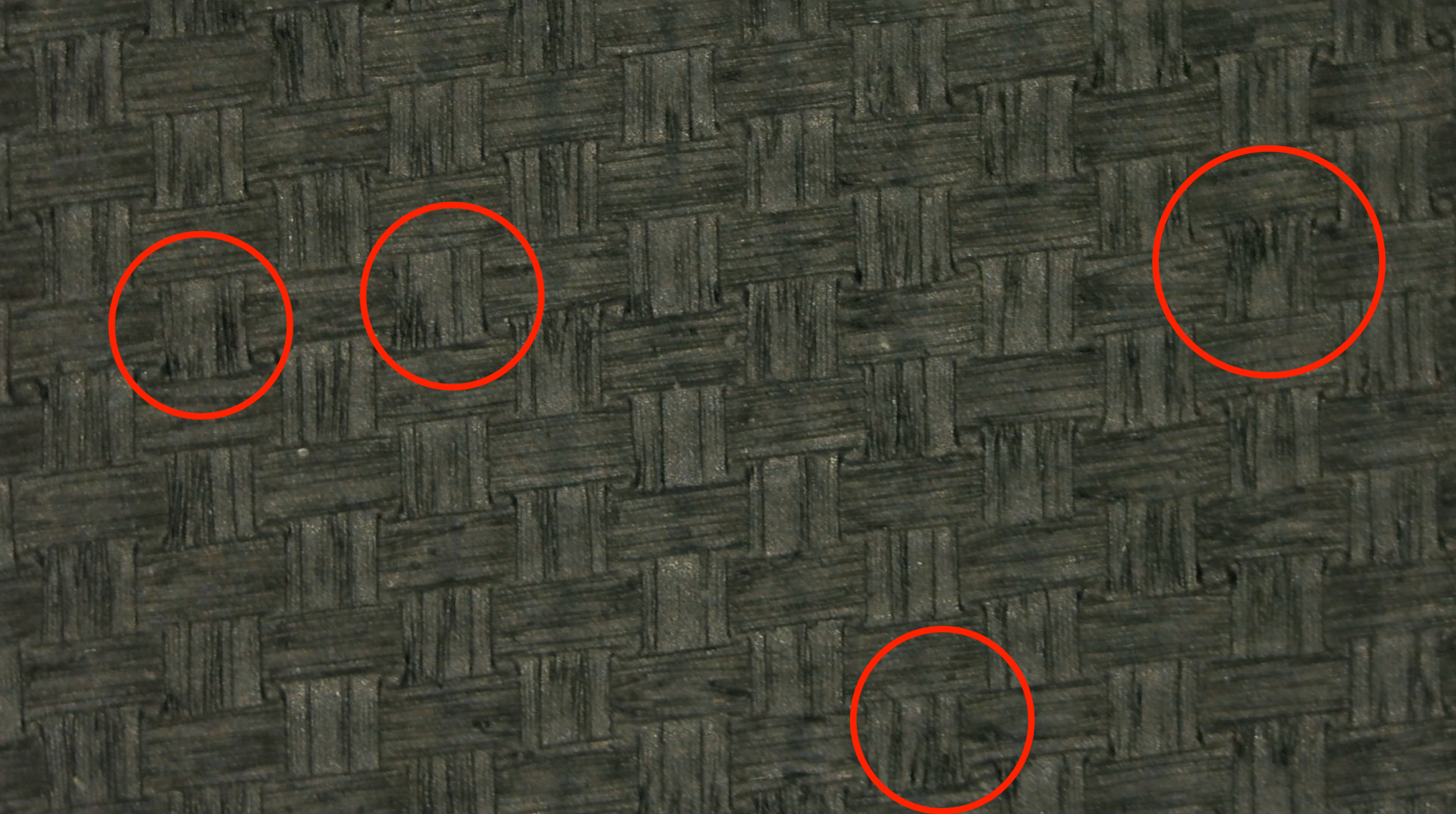 Macro close-up of JOOLA Hyperion CFS pickleball paddle surface texture with red circles marking wear spots