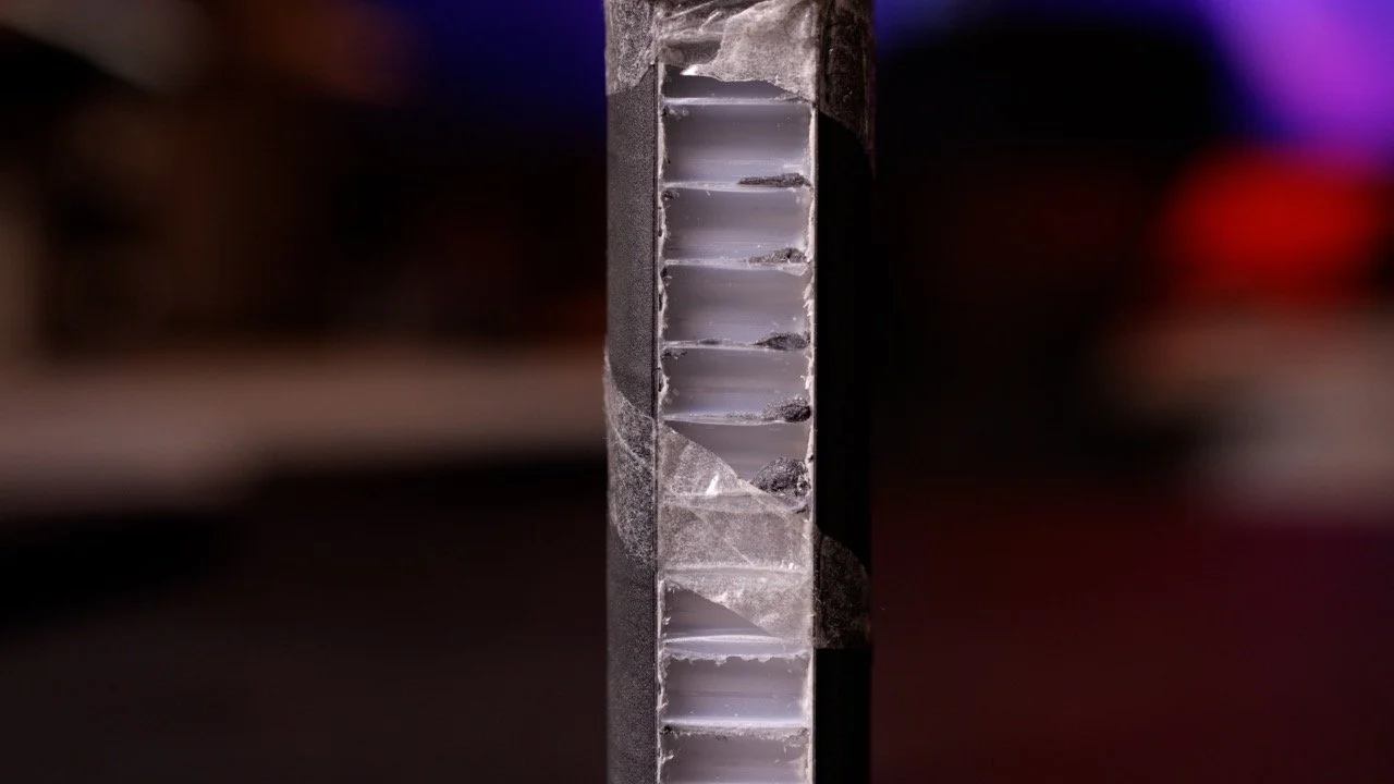Cross-section of SLK Halo Control XL pickleball paddle showing polypropylene honeycomb core structure