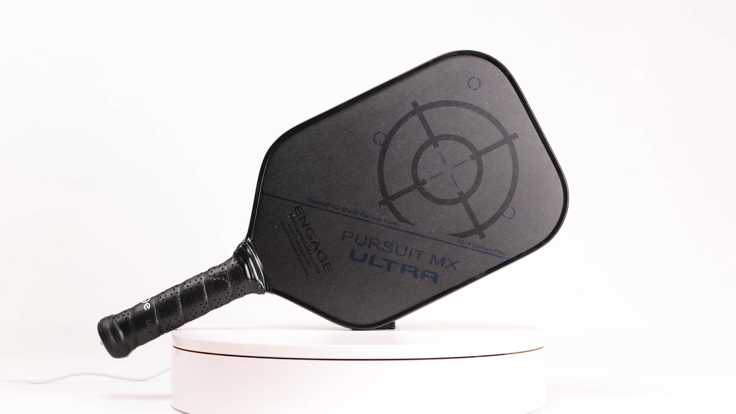 Engage Pursuit MX Ultra pickleball paddle on a white turntable showing full paddle profile