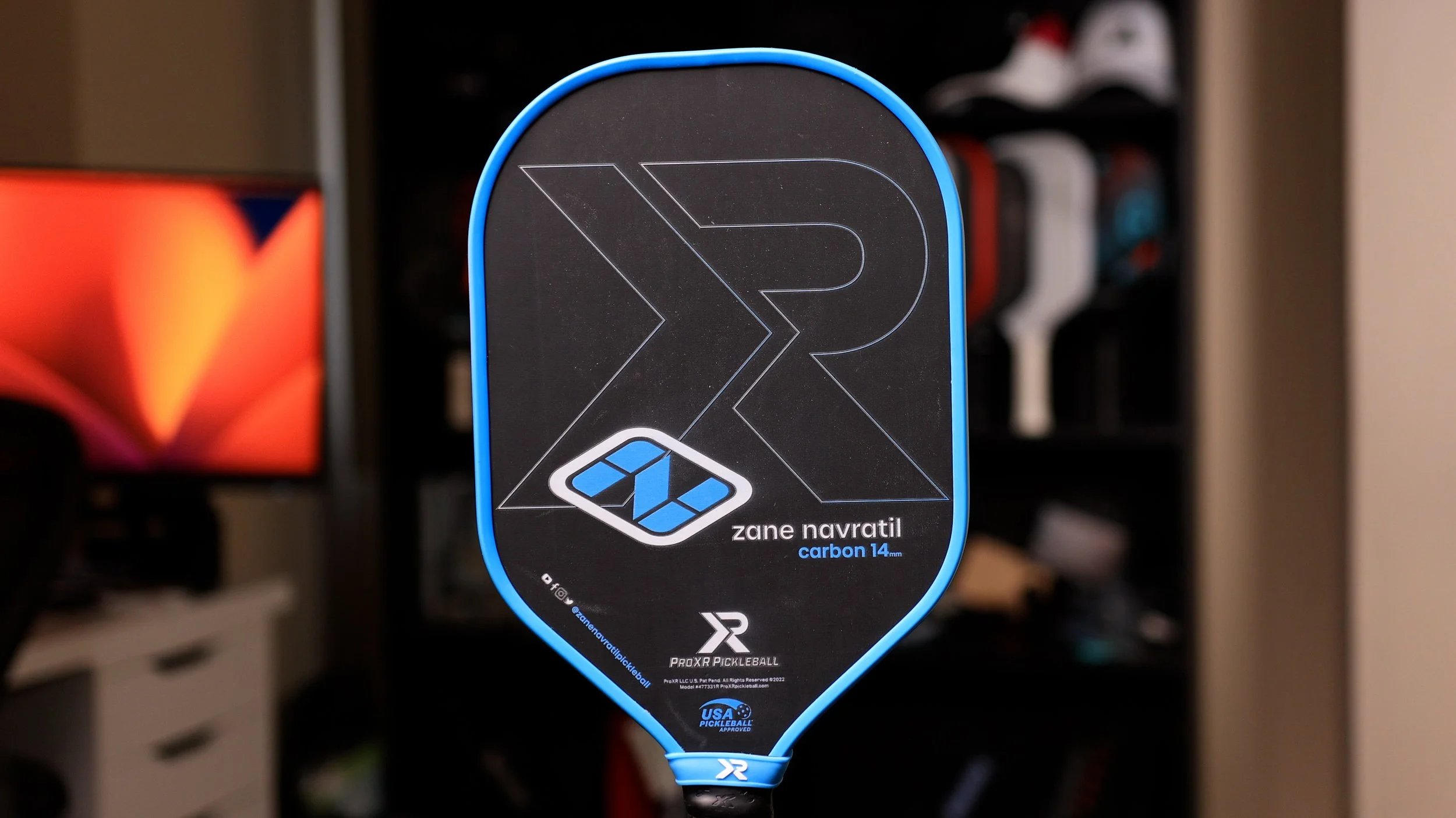 ProXR Zane Navratil Carbon 14 pickleball paddle full front view with blue edge guard and black face