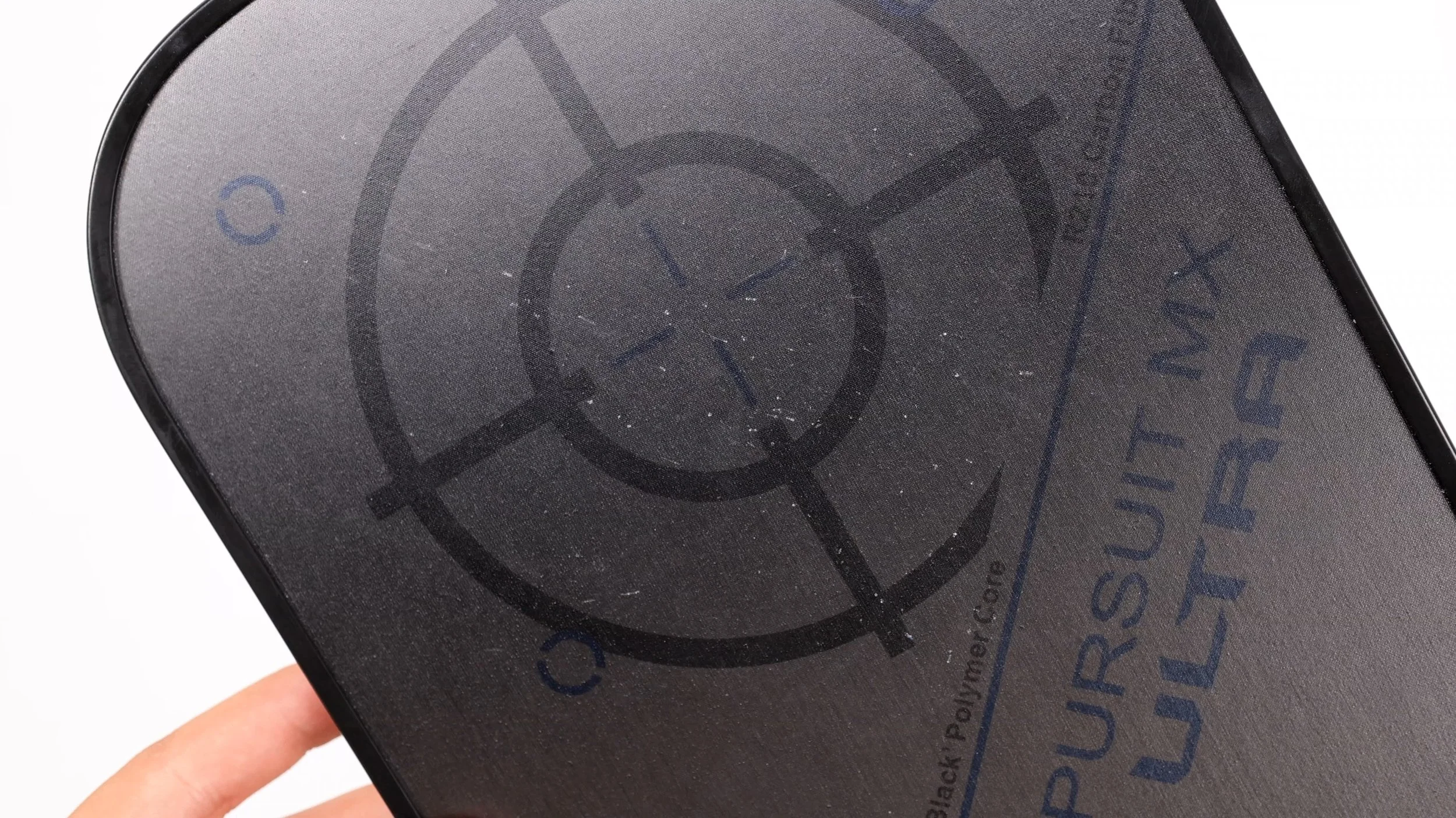 Engage Pursuit MX Ultra pickleball paddle face close-up showing carbon fiber texture and target logo