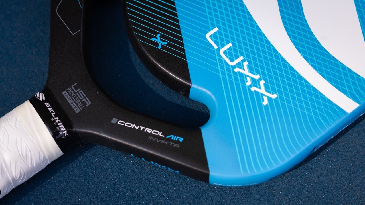 Close-up of Selkirk Luxx Control Air Invikta pickleball paddle throat showing Control Air branding