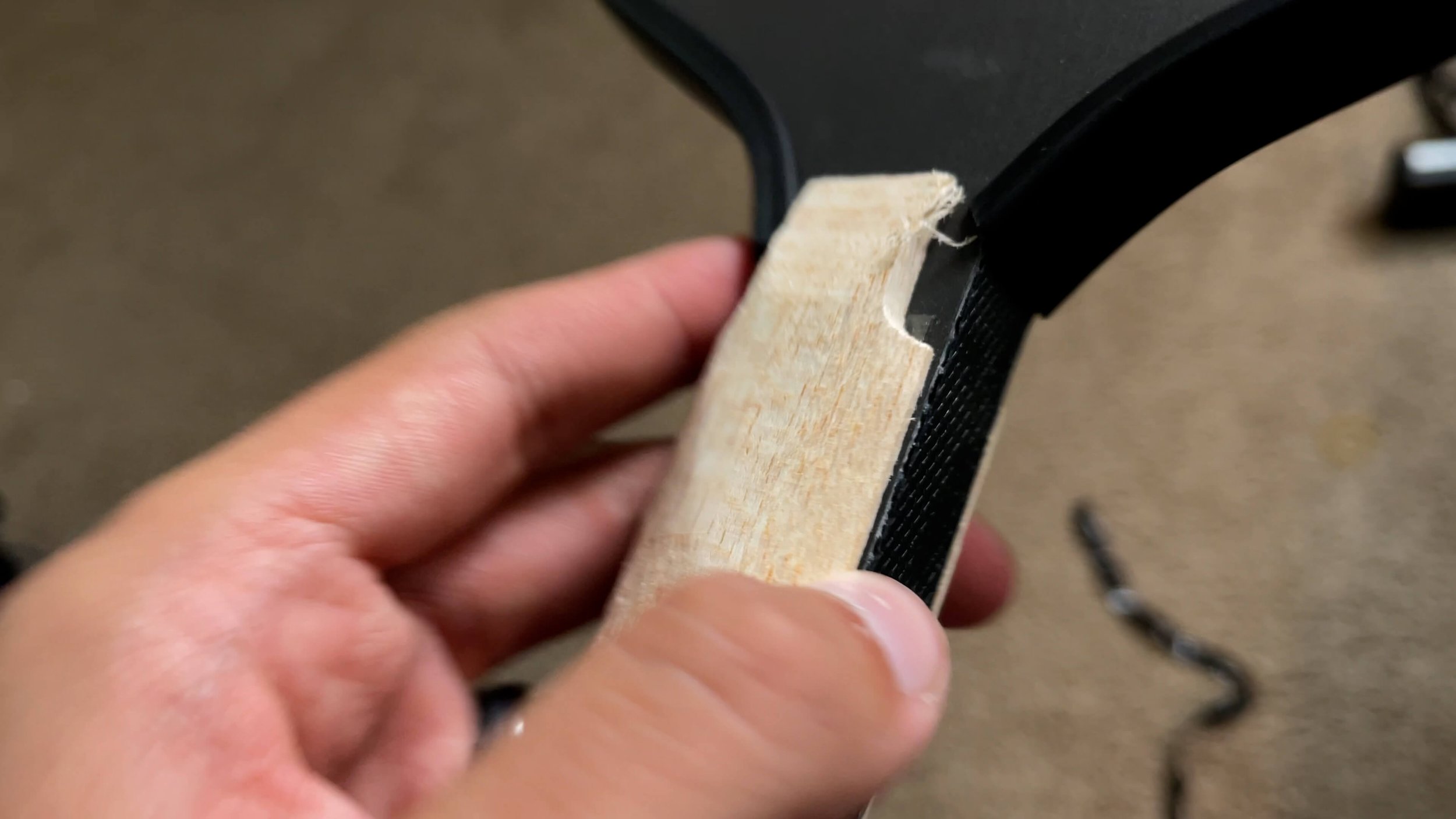 PaddleTek Tempest v3 pickleball paddle grip butt cap with wooden handle extension visible