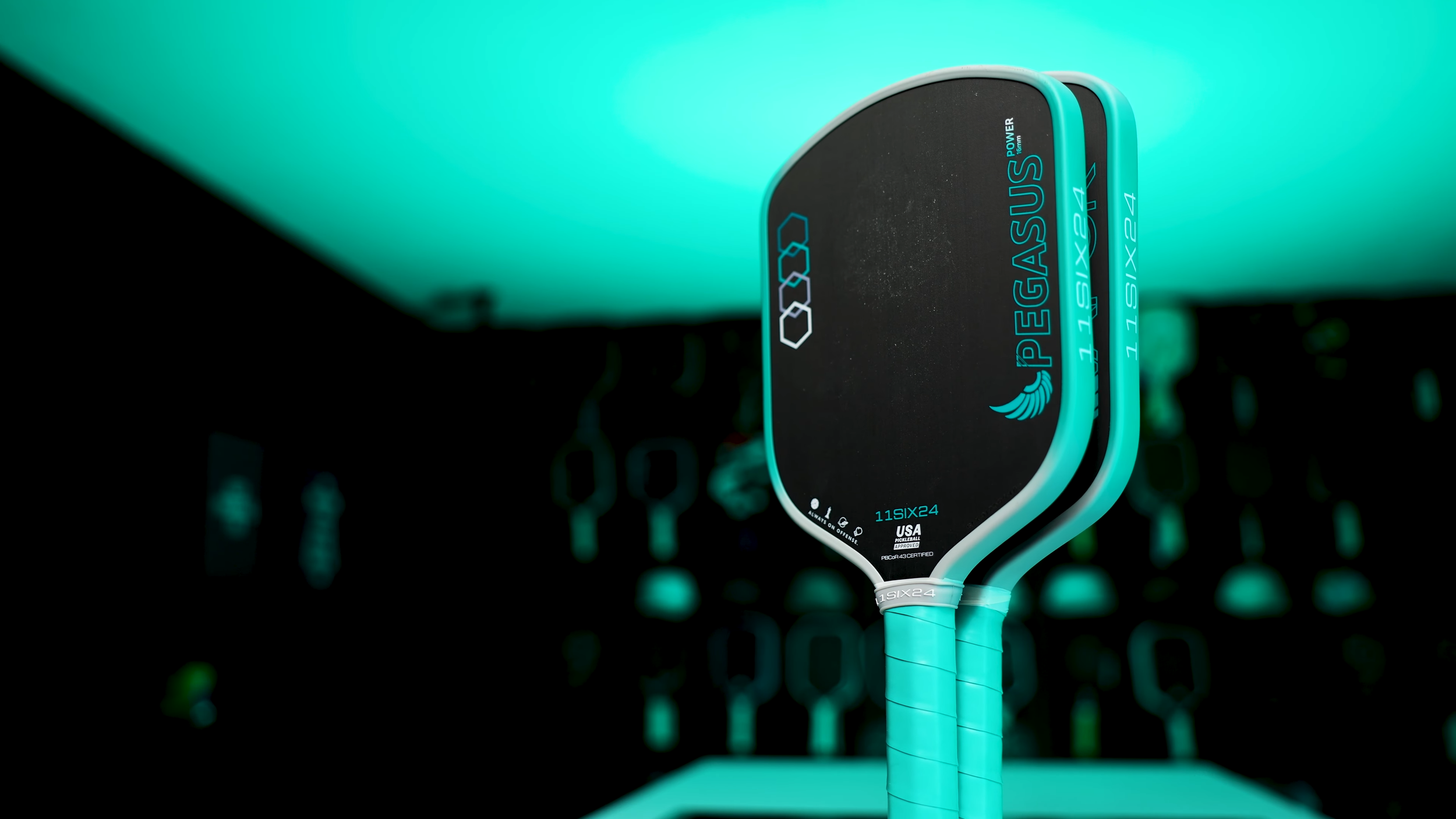 11SIX24 Pegasus pickleball paddle displayed next to another 11SIX24 paddle for size comparison