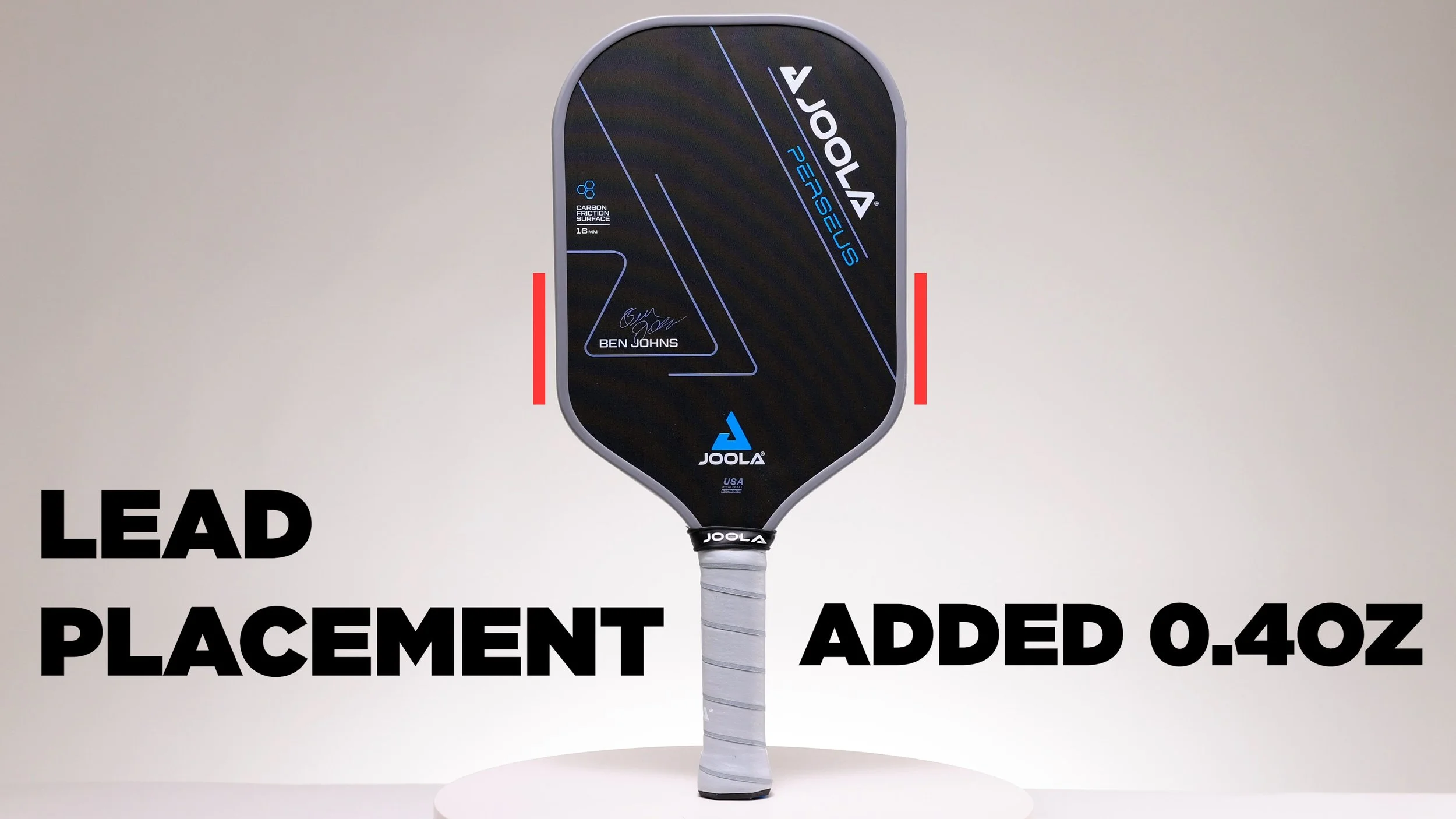 JOOLA Ben Johns Perseus pickleball paddle with lead tape placement markers showing 0.4oz added weight