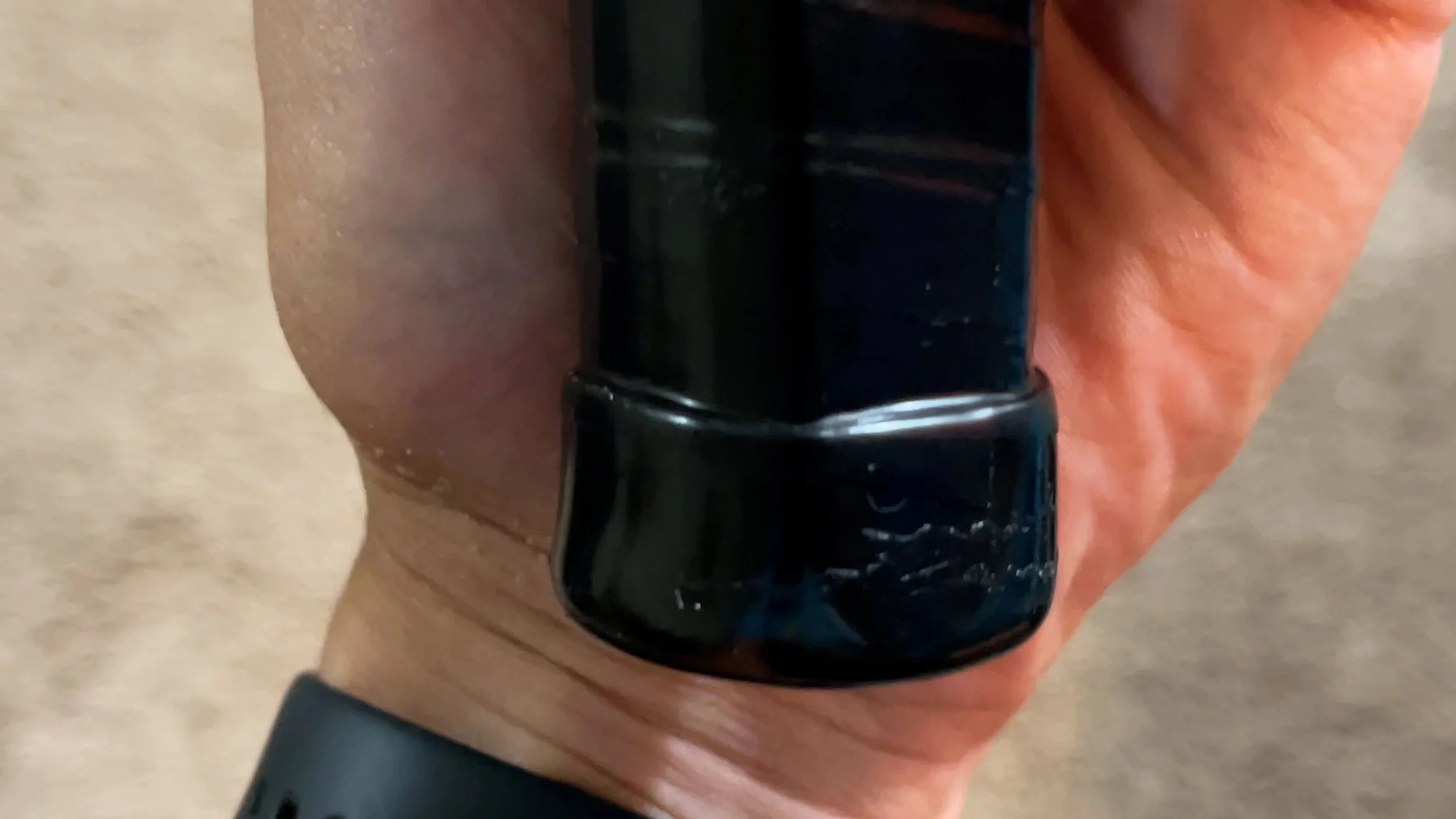 PaddleTek Tempest v3 pickleball paddle grip butt cap close-up showing end construction