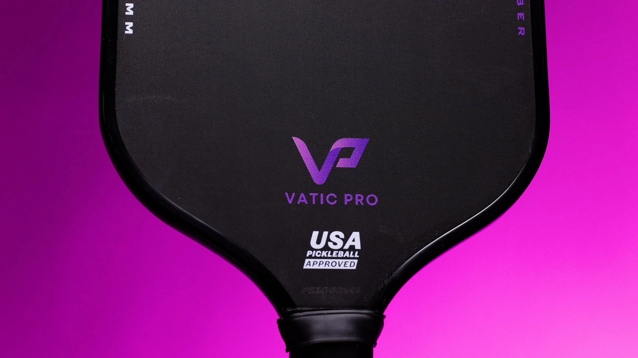 Vatic Pro Prism pickleball paddle close-up showing face and USA Pickleball approved badge on purple background
