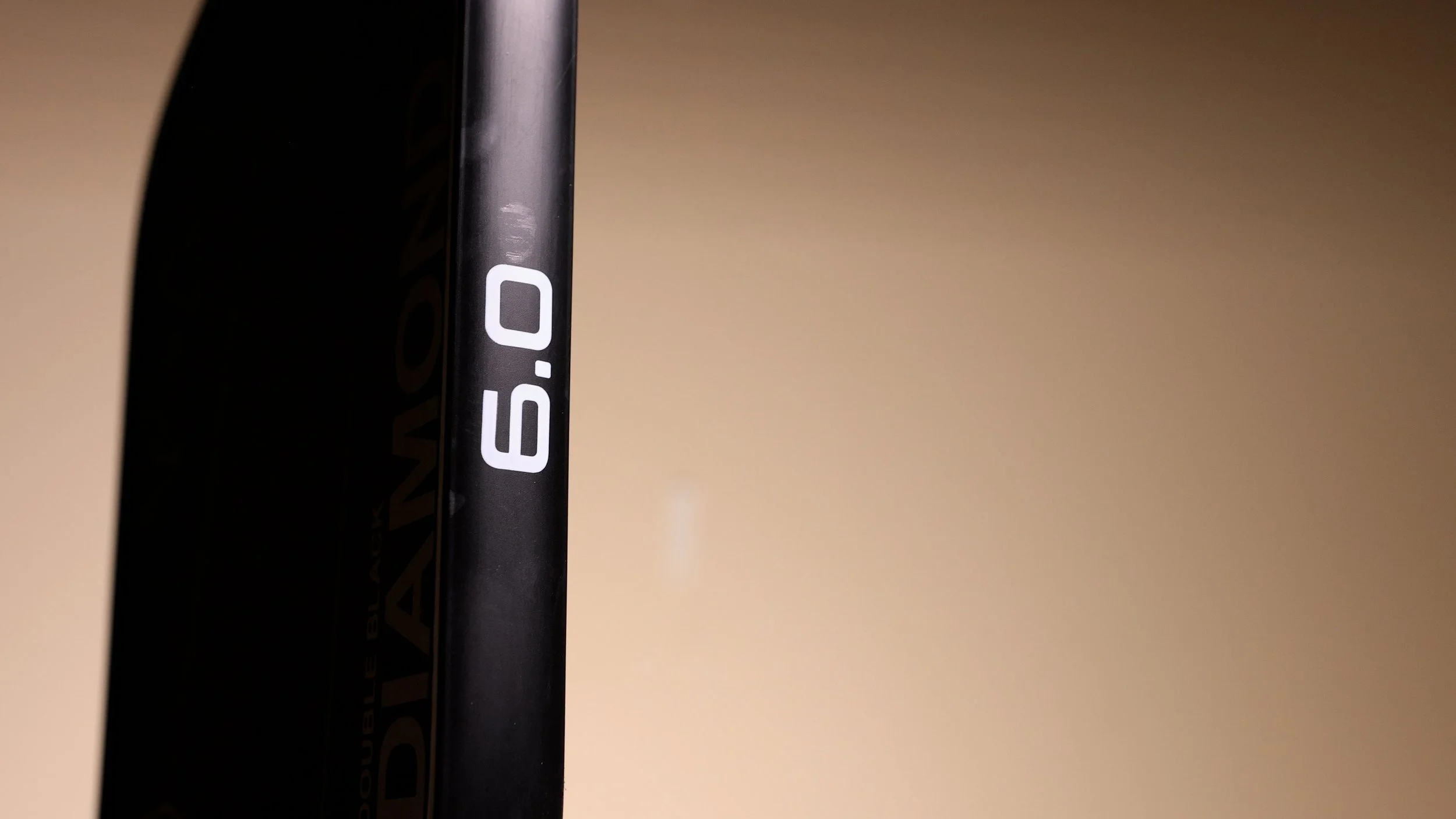 Six Zero Double Black Diamond 16mm pickleball paddle edge showing 6.0 branding