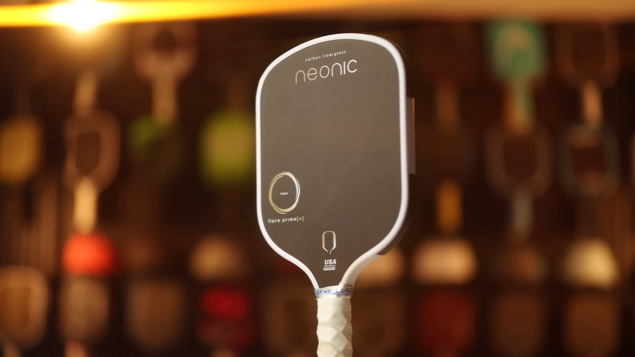 Neonic Flare Prime X pickleball paddle full view with white edge guard and dark face