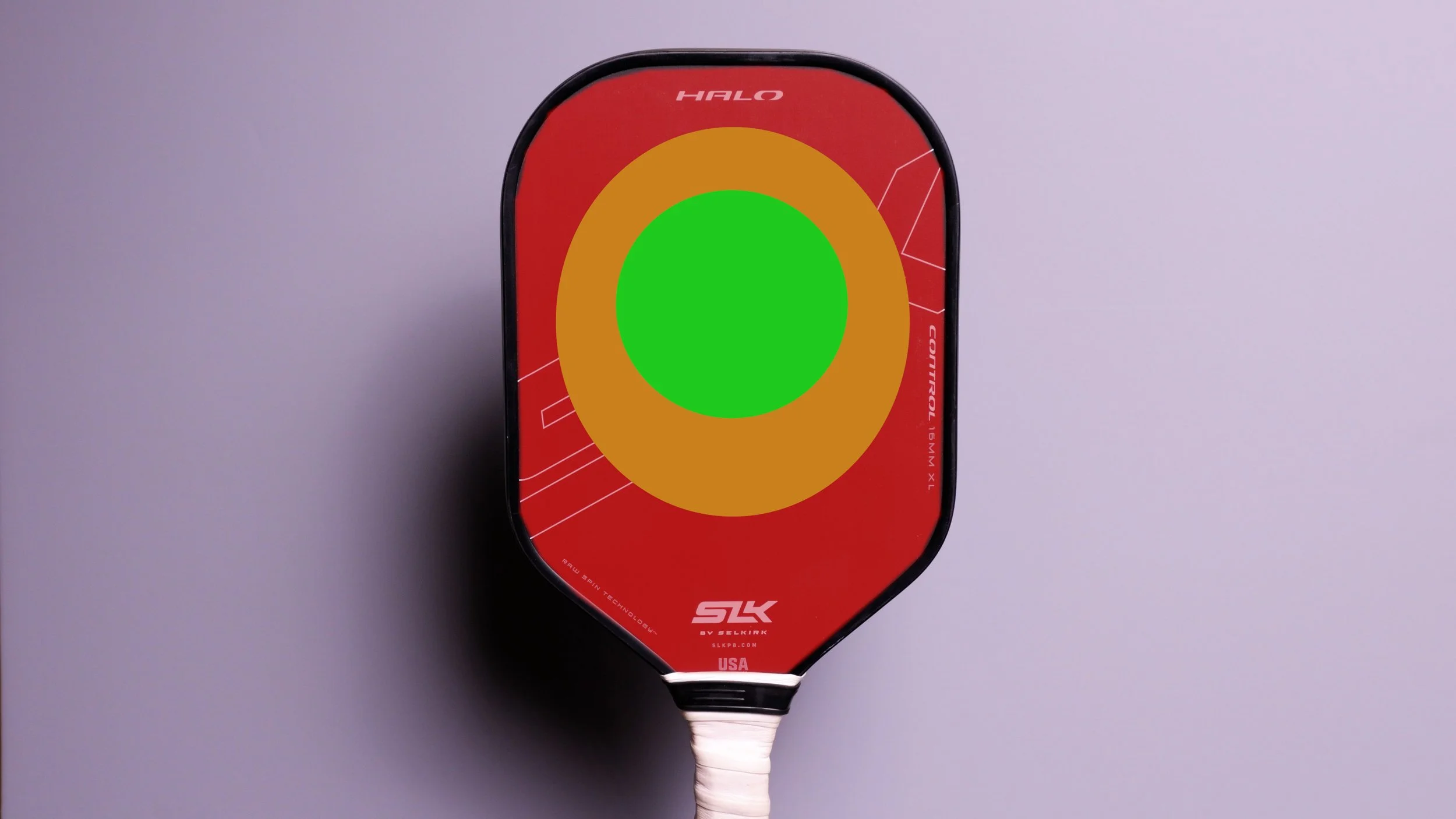 SLK Halo Control XL pickleball paddle sweet spot heat map overlay showing green center zone on red background