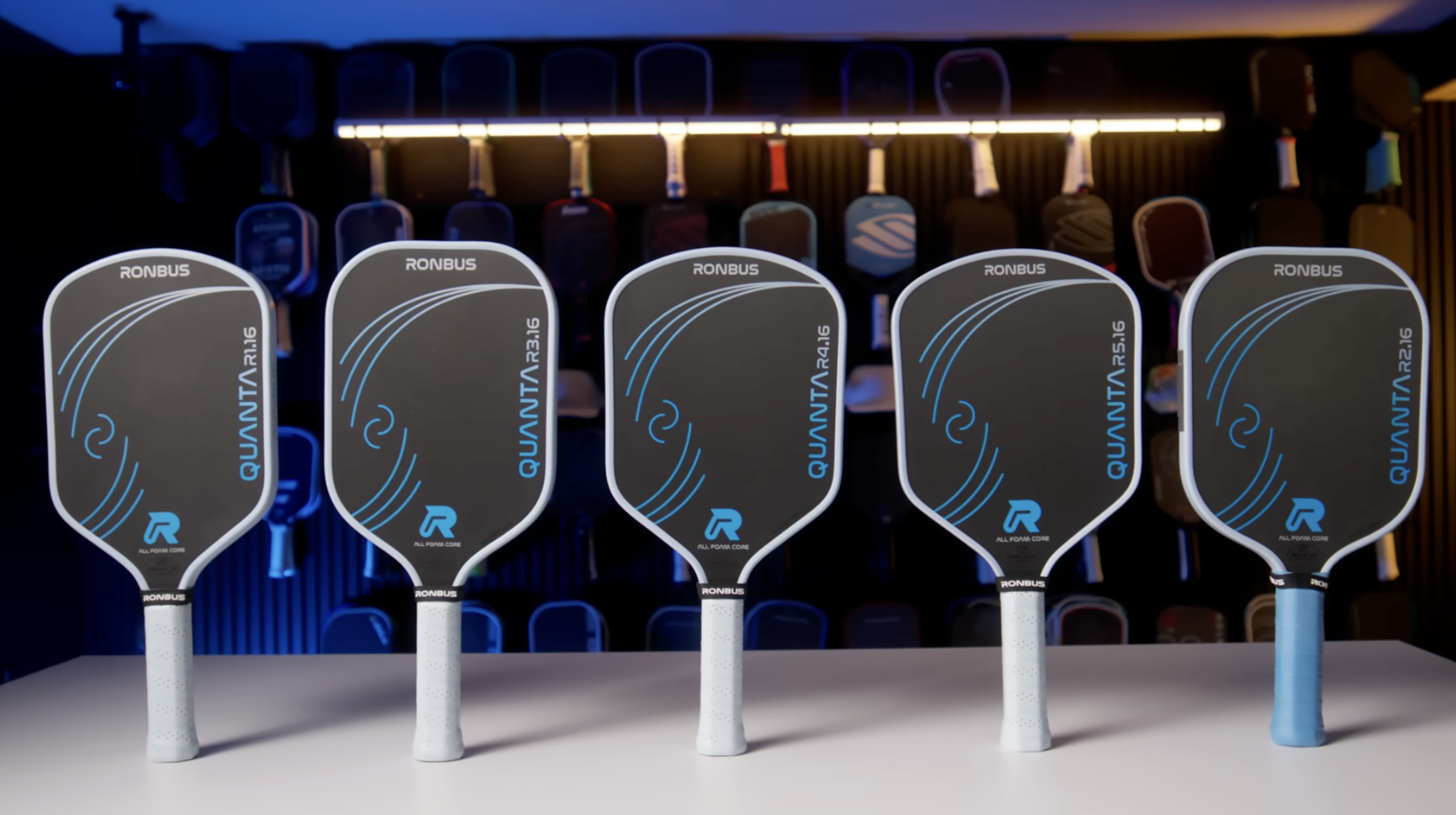 Five Ronbus Quanta pickleball paddles lined up showing all available shapes and sizes