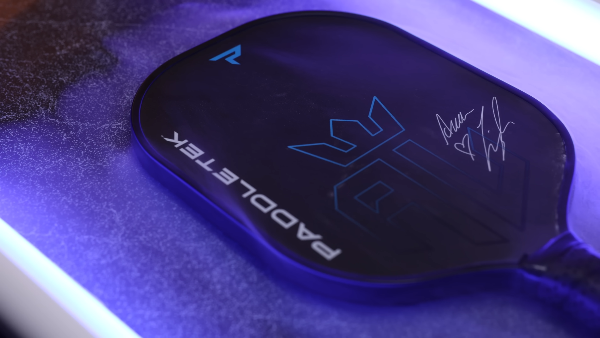 PaddleTek Bantam ESQ-C pickleball paddle with blue lighting and signature design