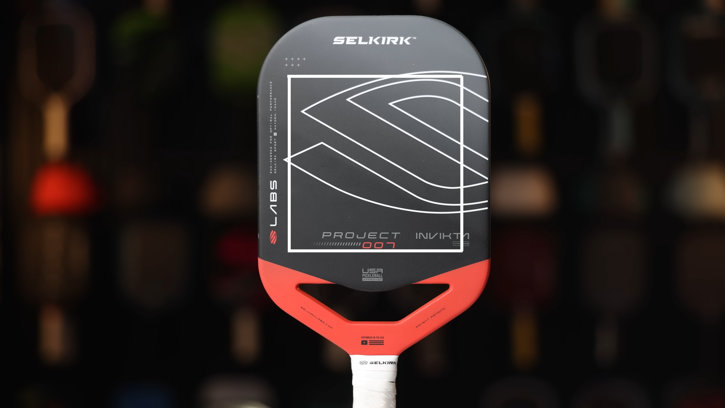 Selkirk Labs Project 007 Invikta pickleball paddle front view with dark face and red throat accent