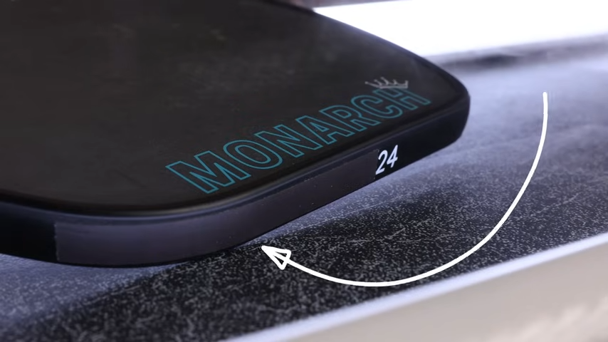 Close-up of 11SIX24 Monarch Jelly Bean pickleball paddle edge profile showing thin edge guard design