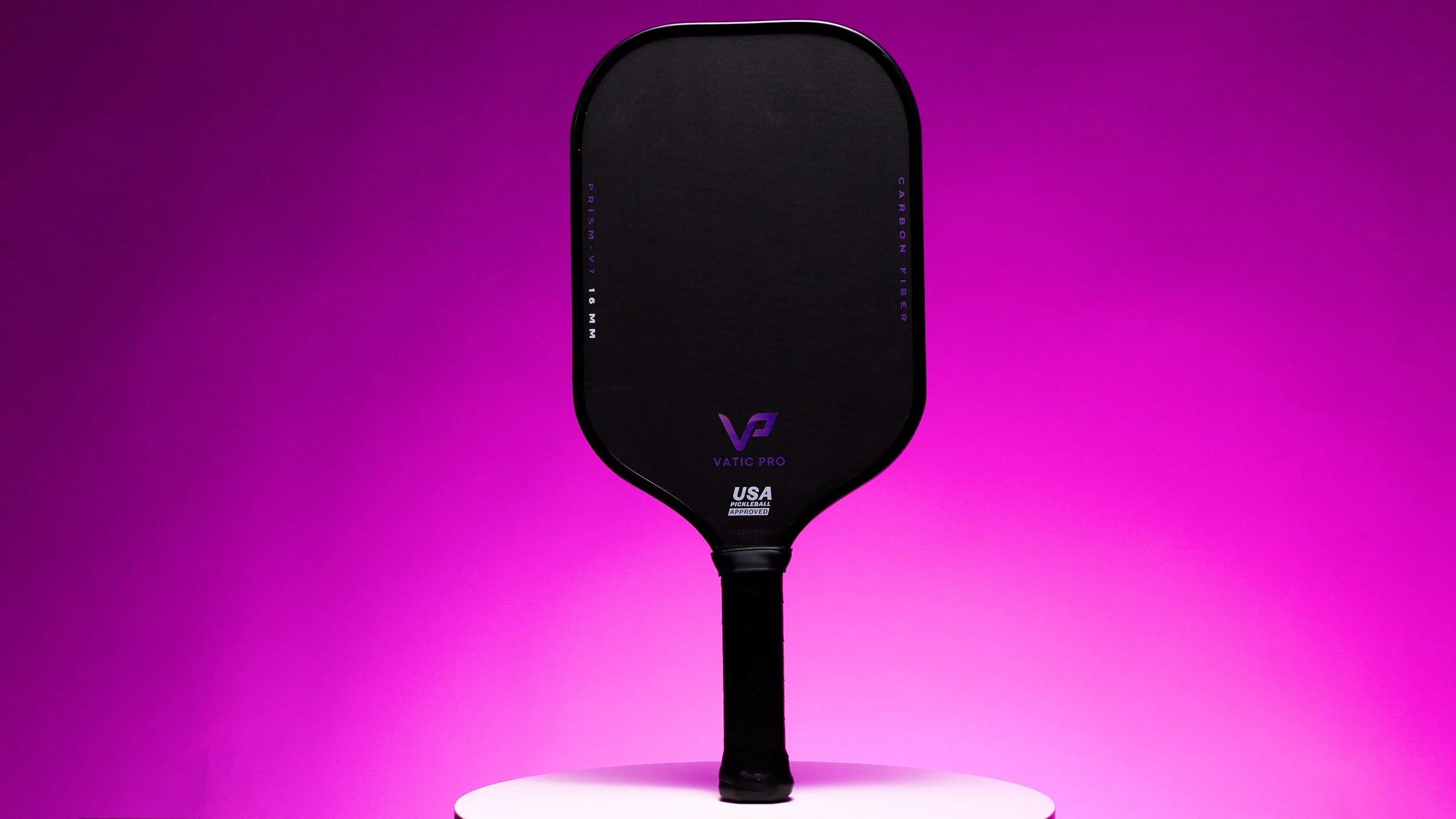 Vatic Pro Prism pickleball paddle on purple background showing full paddle face