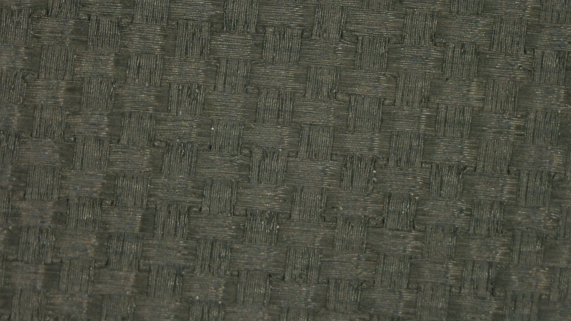 Close-up of ProXR Zane Navratil Carbon 14 pickleball paddle raw carbon fiber face texture