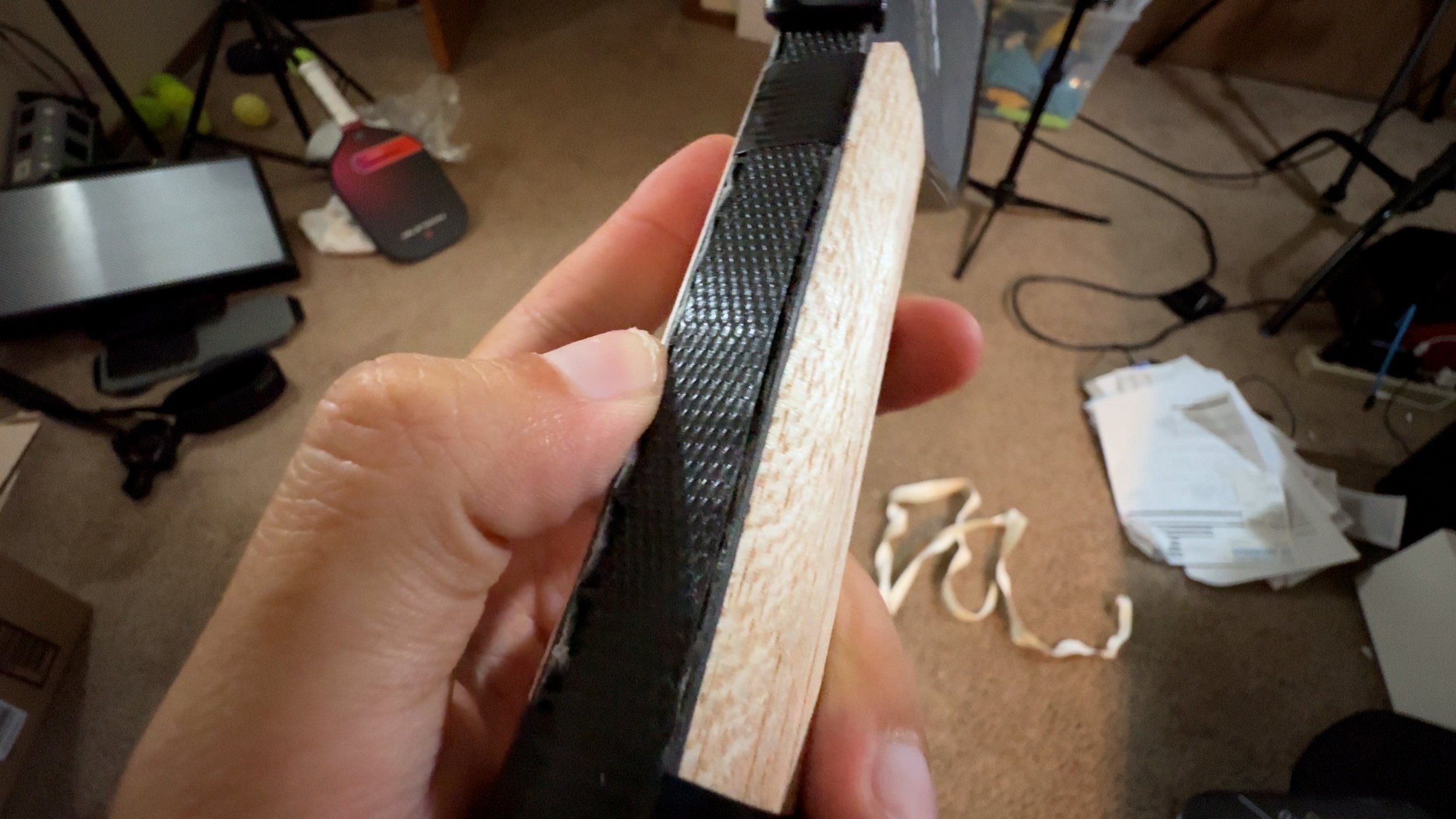 Engage Pursuit Pro pickleball paddle teardown showing wood shaping piece and carbon fiber face layers