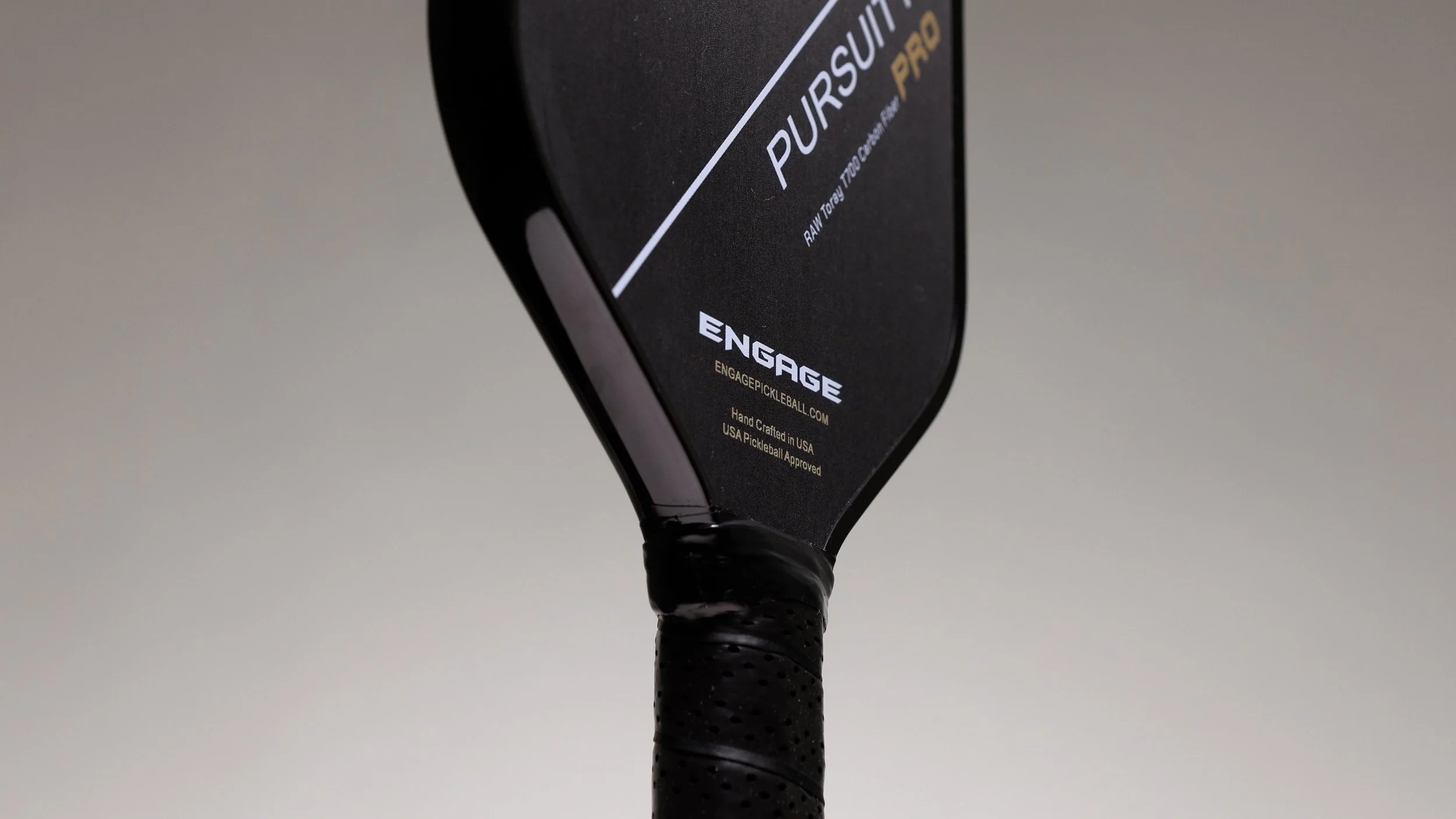 Engage Pursuit Pro pickleball paddle front view showing edge guard and target logo design