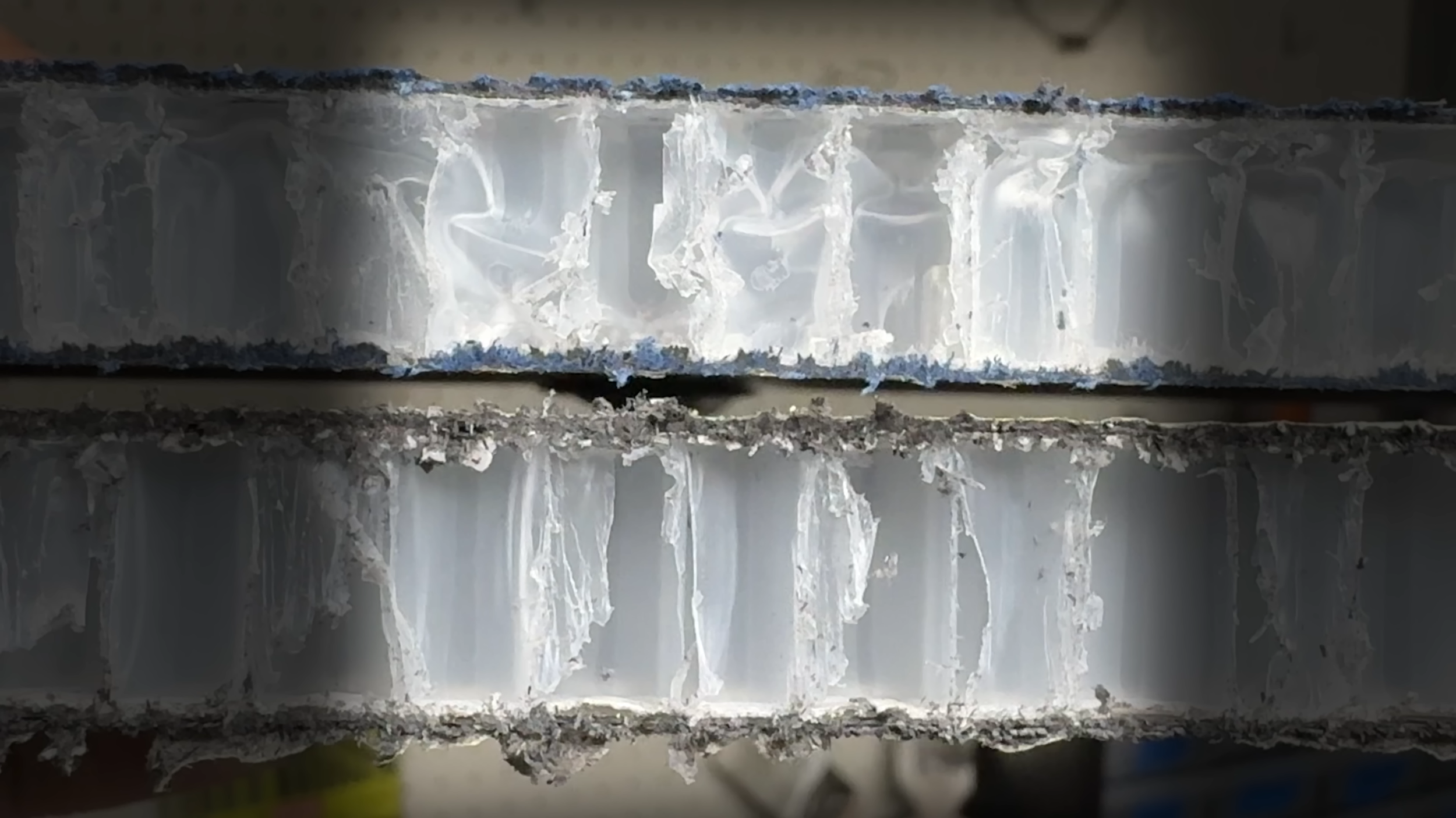 Cross-section of JOOLA pickleball paddle core showing honeycomb cell structure under magnification