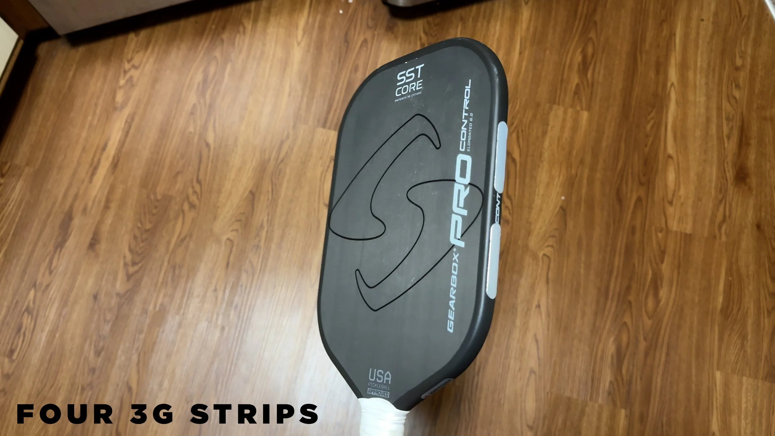 Gearbox Pro Control Fusion pickleball paddle with four 3g lead tape strips on the edge