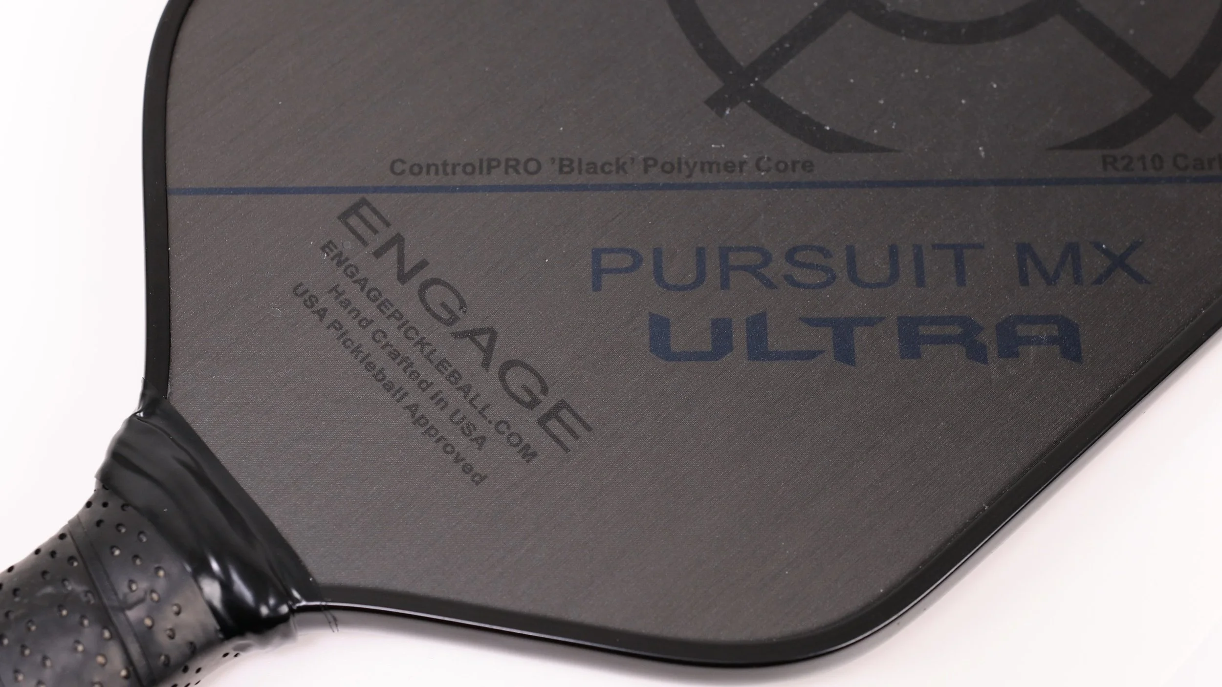 Engage Pursuit MX Ultra pickleball paddle close-up showing ControlPRO Black Polymer Core and R219 carbon fiber specs