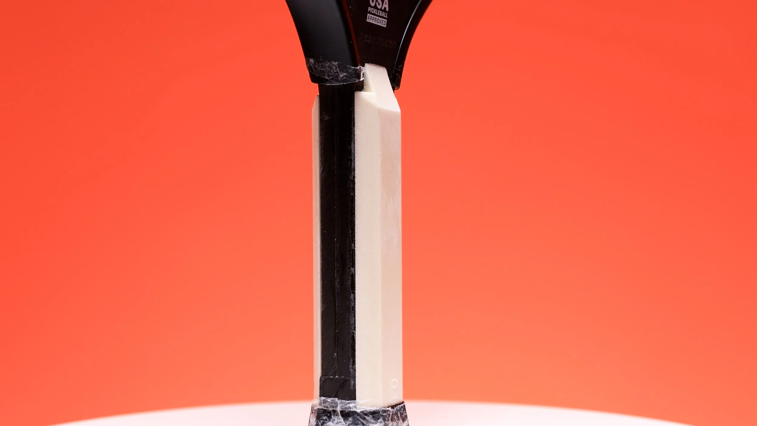 Vatic Pro Alchemy 13.5mm pickleball paddle handle showing foam injected core construction Vatic Pro Alchemy 13.5mm pickleball paddle handle showing foam injected core construction