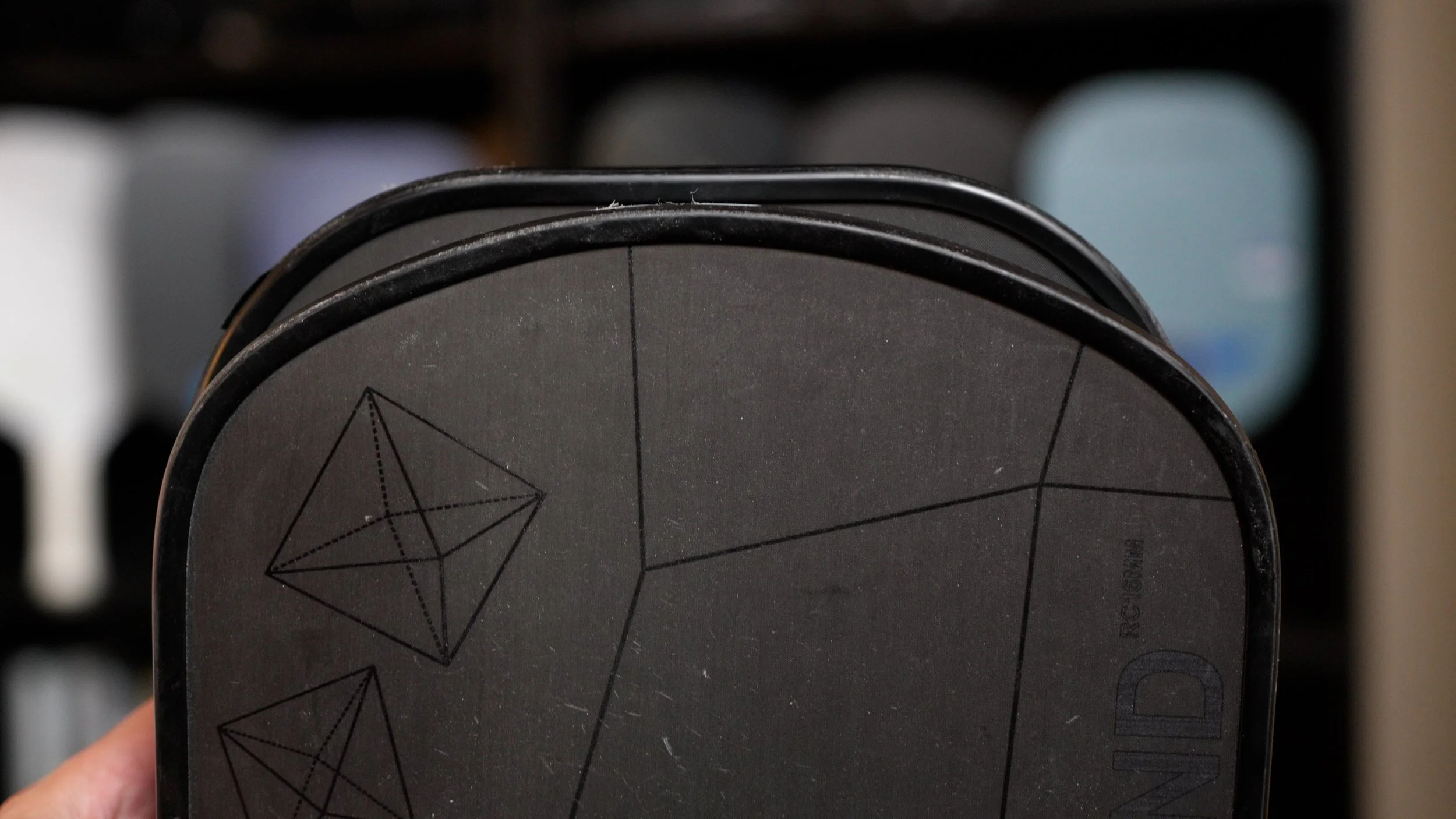 Six Zero Double Black Diamond pickleball paddle face close-up showing geometric diamond pattern design