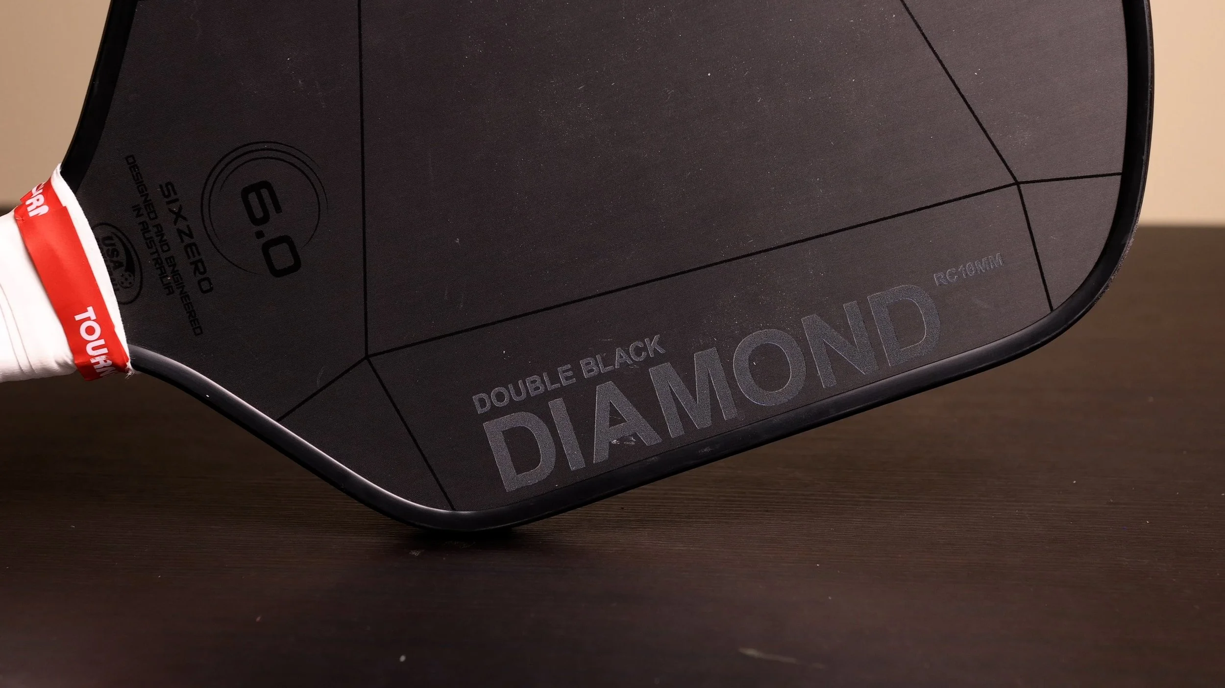 Six Zero Double Black Diamond 16mm pickleball paddle close-up of face showing matte black design