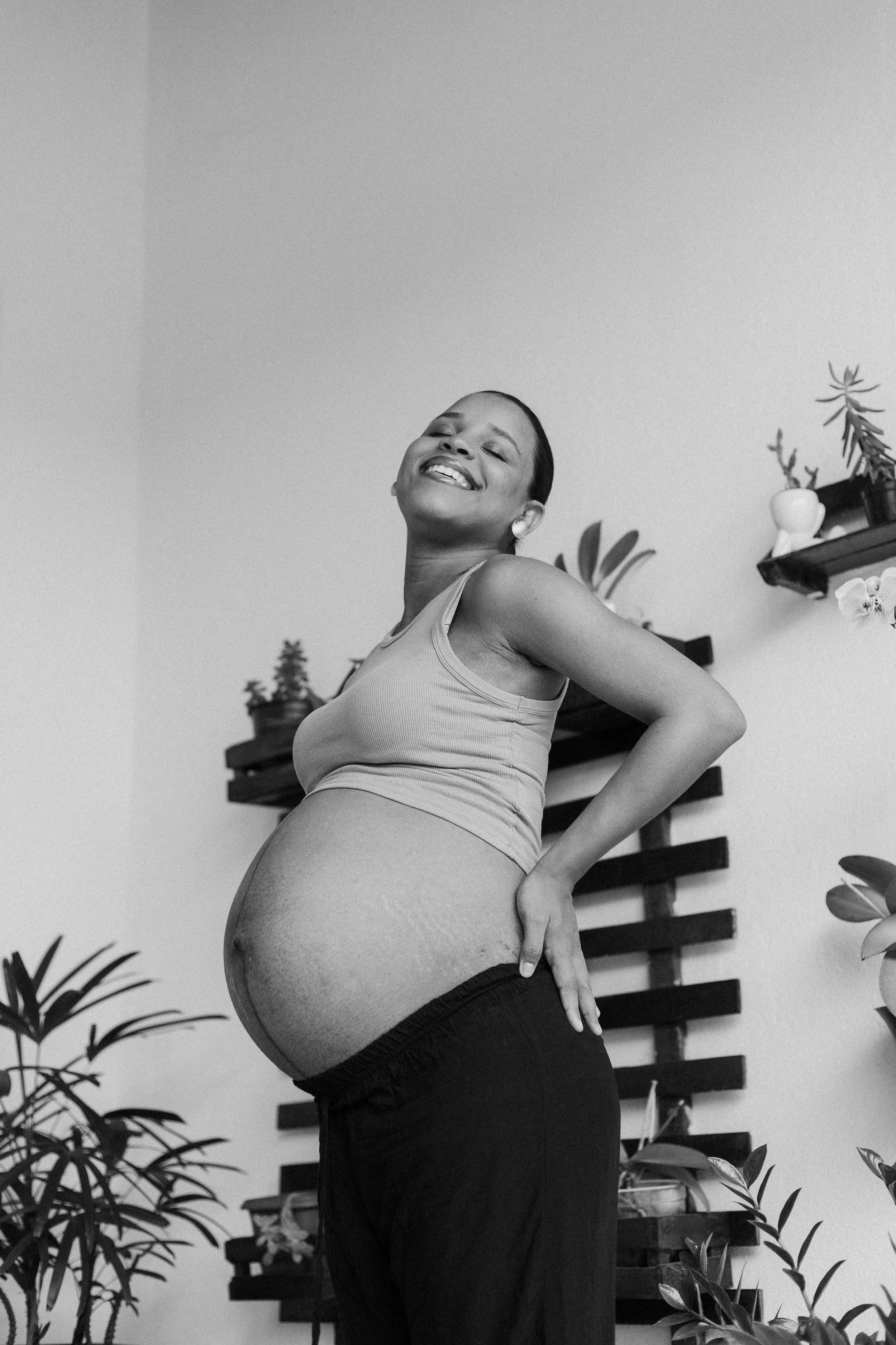 pregnant mother with round baby belly
