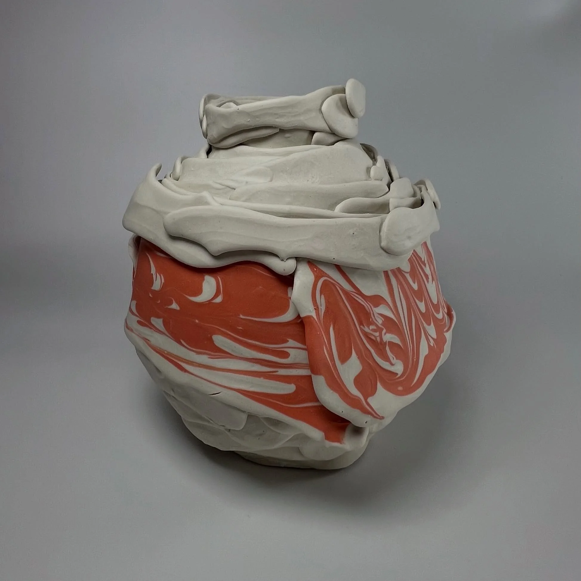Where the surface breaks open. 🤍🧡
Handmade porcelain, coral marbling.