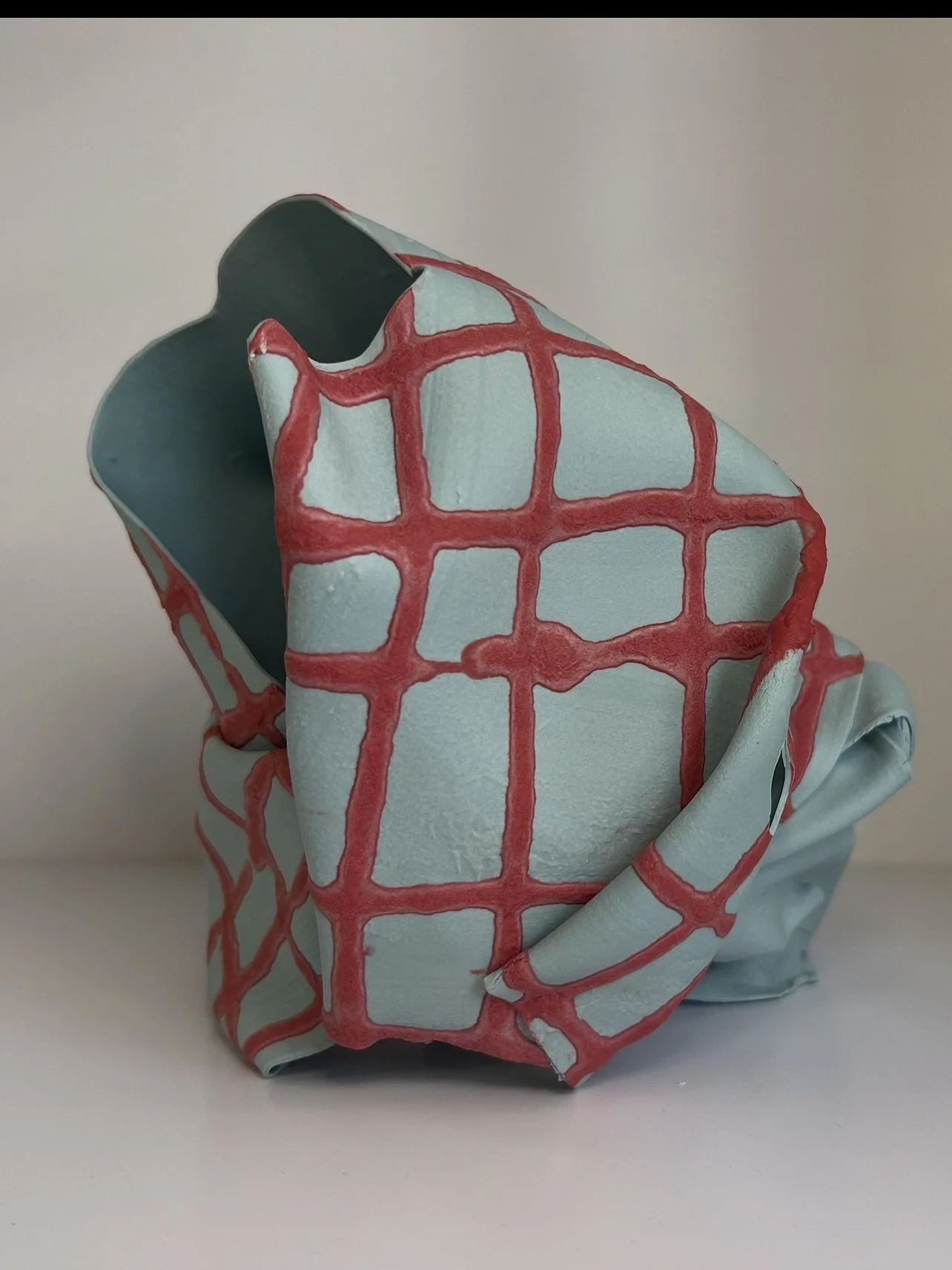 Folded Dimensions &mdash; where clay meets geometry. 
In this piece, structure and spontaneity coexist: crisp folds, dynamic form, and subtle color shifts play out in paper porcelain. 

#Ceramics #Sculpture #ArtOfClay #porcelain